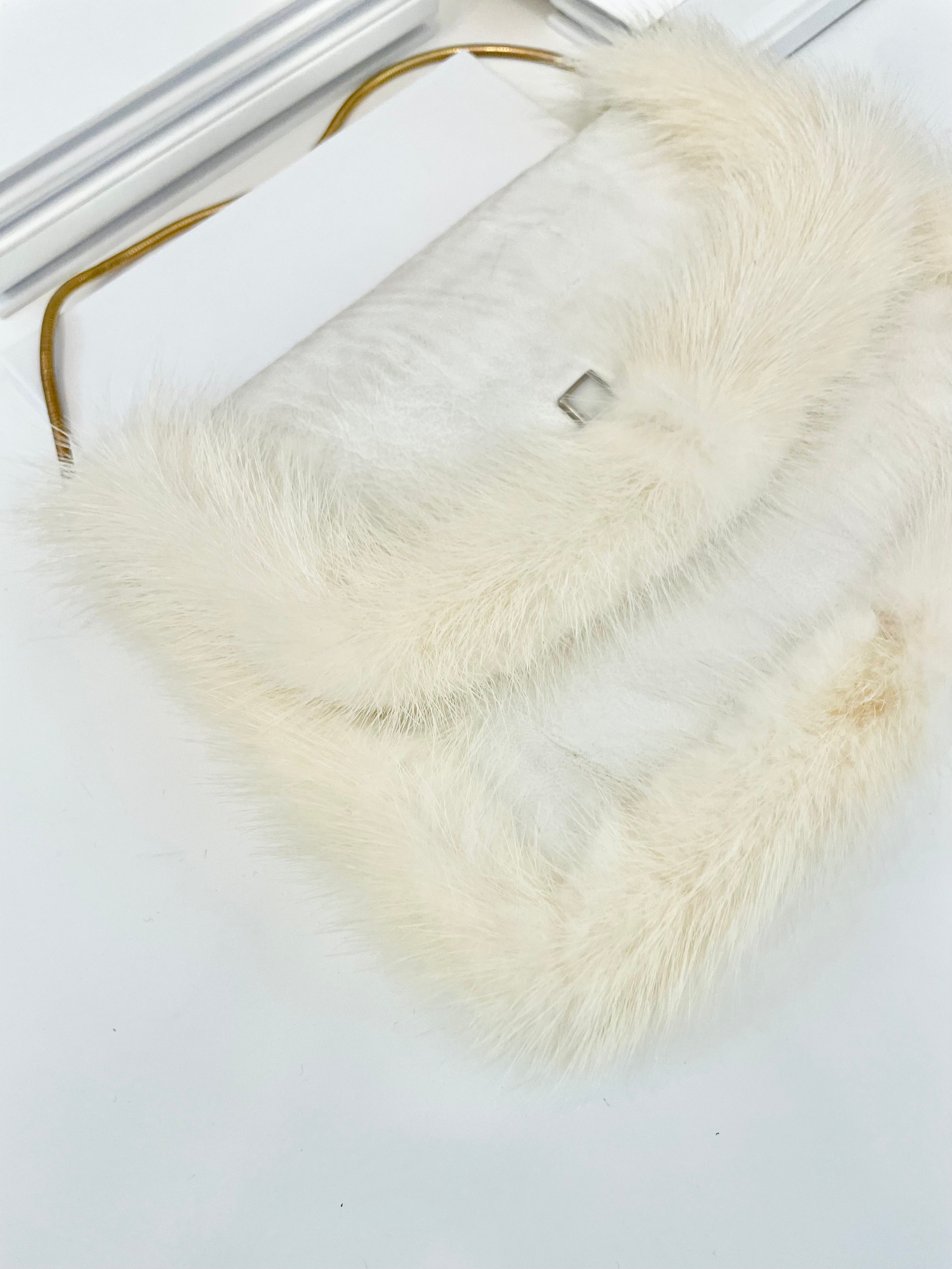 The 1960's heiress adores a fur clutch bag.... this one is so glamorous!