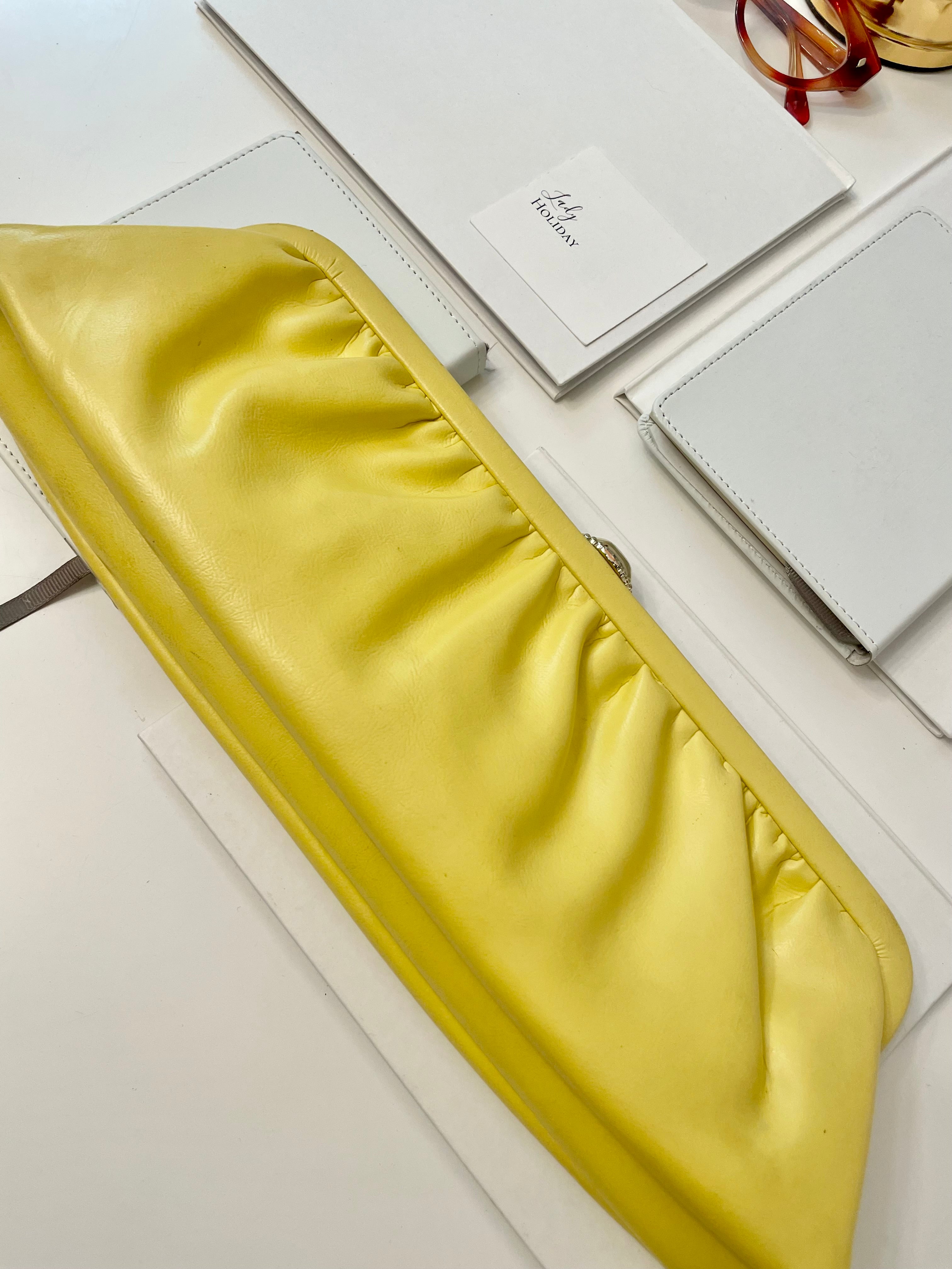 The Cocktail hour bag... so chic. This 1960's bright yellow long clutch bag, is exactly the perfect bag for ladies night with the gals!