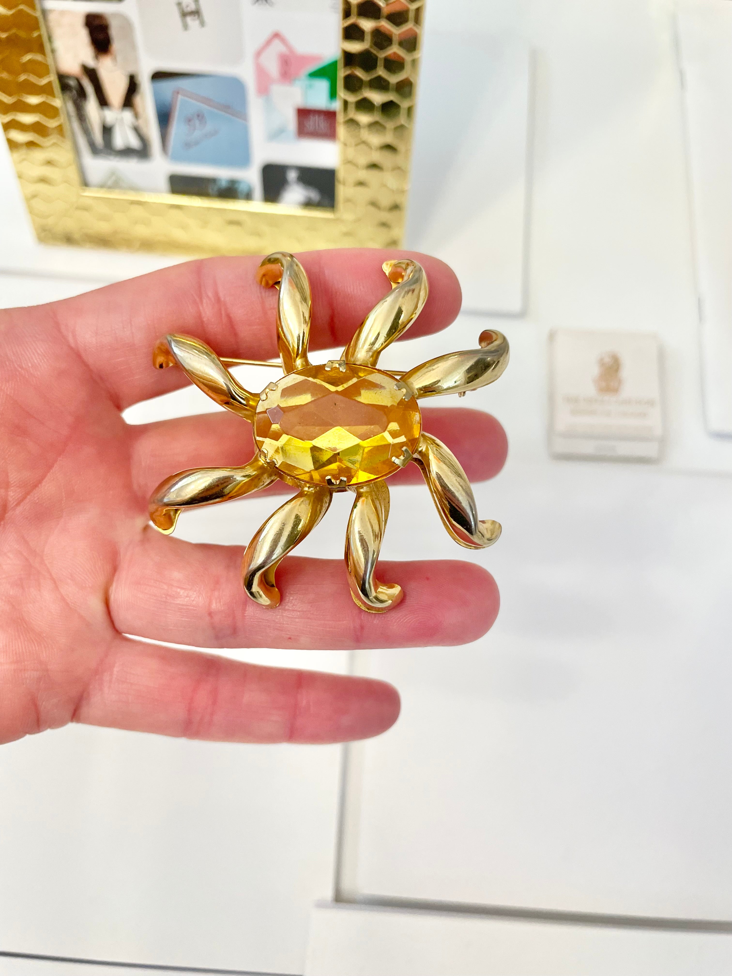 The most divine citrine glass, starburst gold classy brooch...