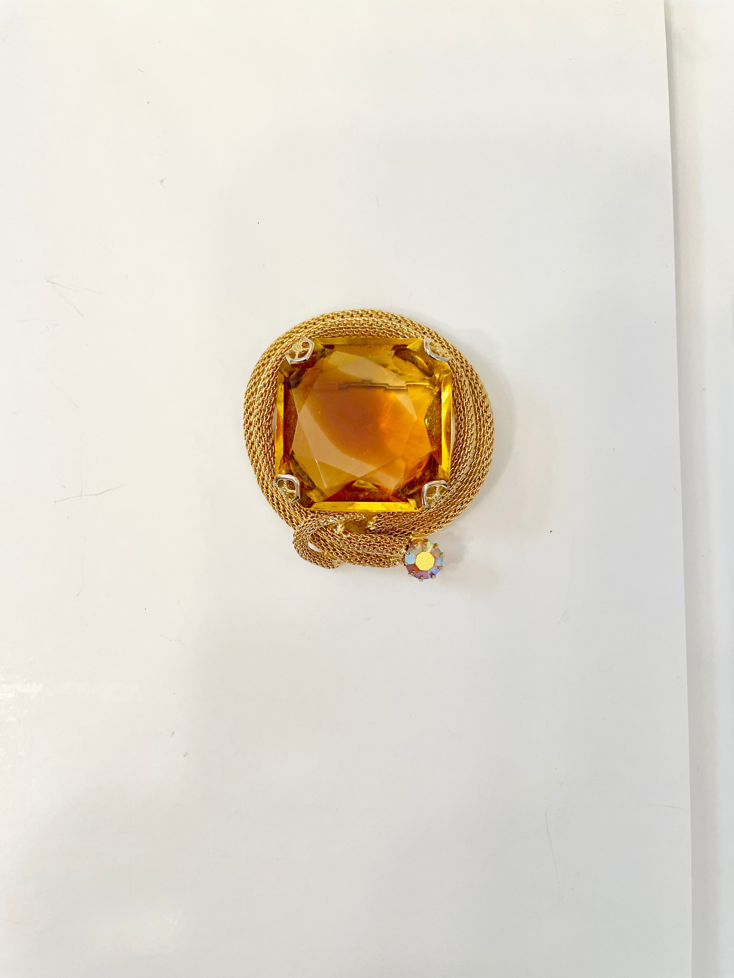 Rich and oh so classy! This stunning citrine colored glass brooch is truly chic!