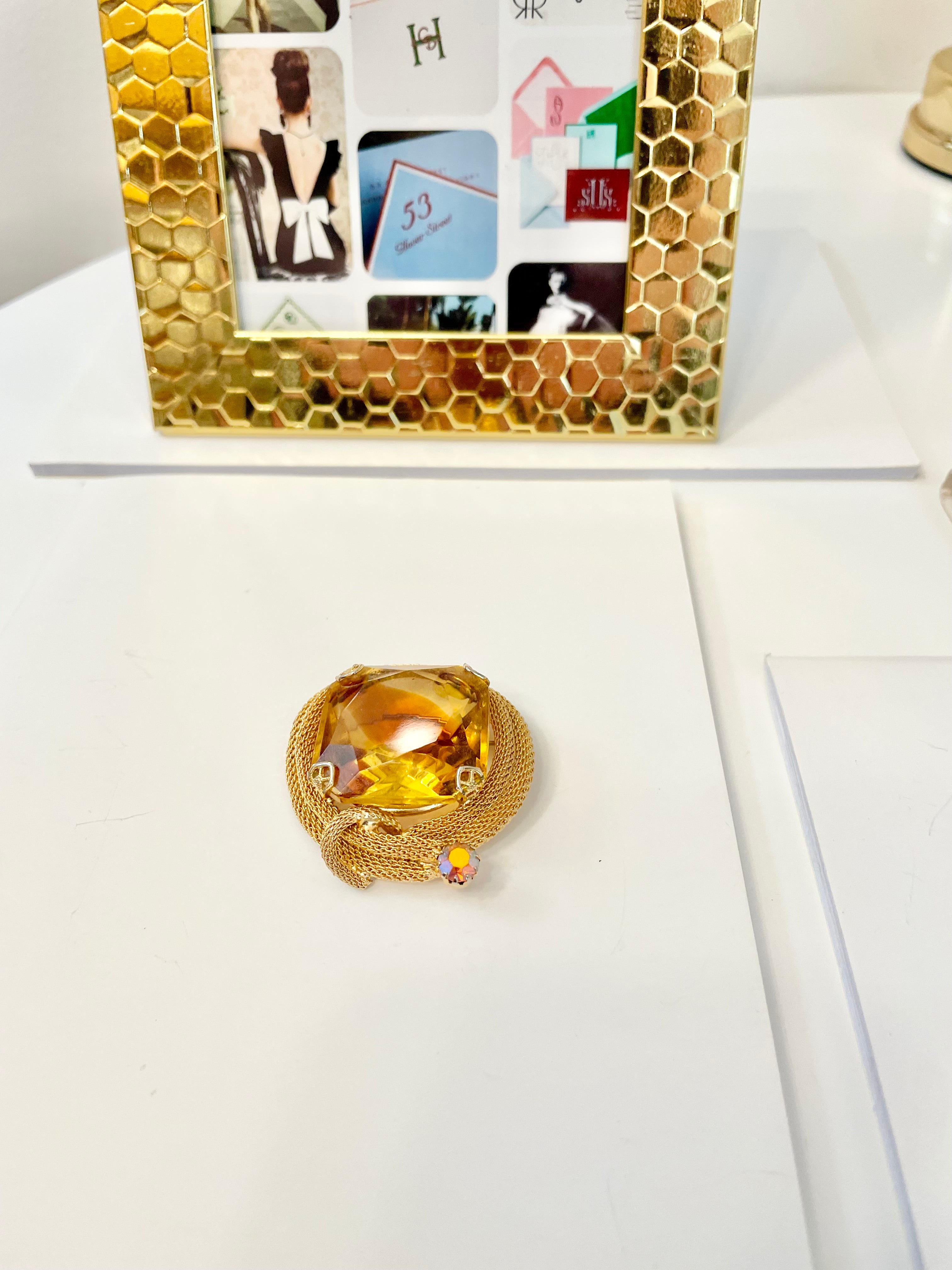 Rich and oh so classy! This stunning citrine colored glass brooch is truly chic!