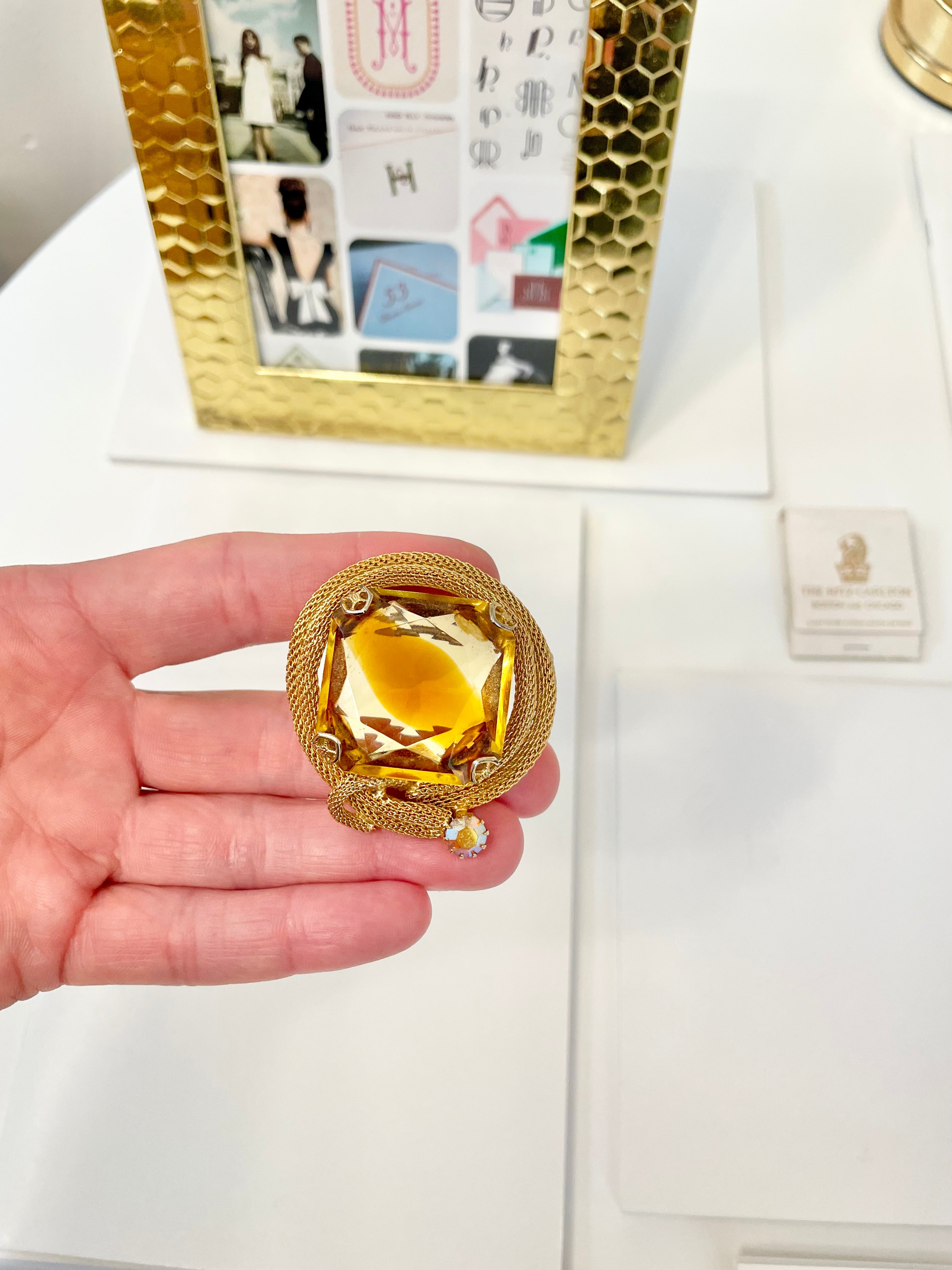 Rich and oh so classy! This stunning citrine colored glass brooch is truly chic!