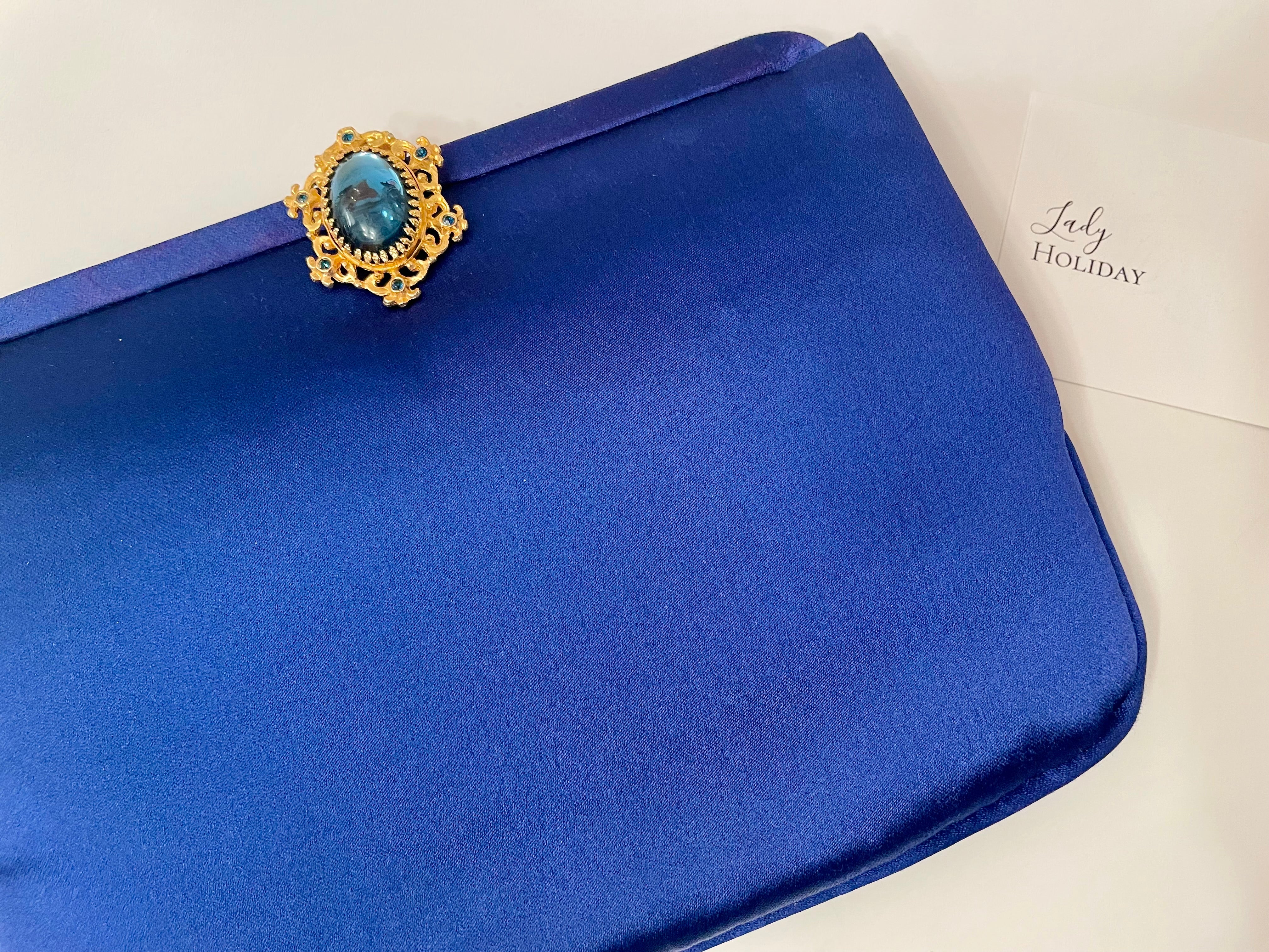 Glamorous and chic, 1960's vintage rich royal blue satin clutch bag, with stunning closure...so elegant