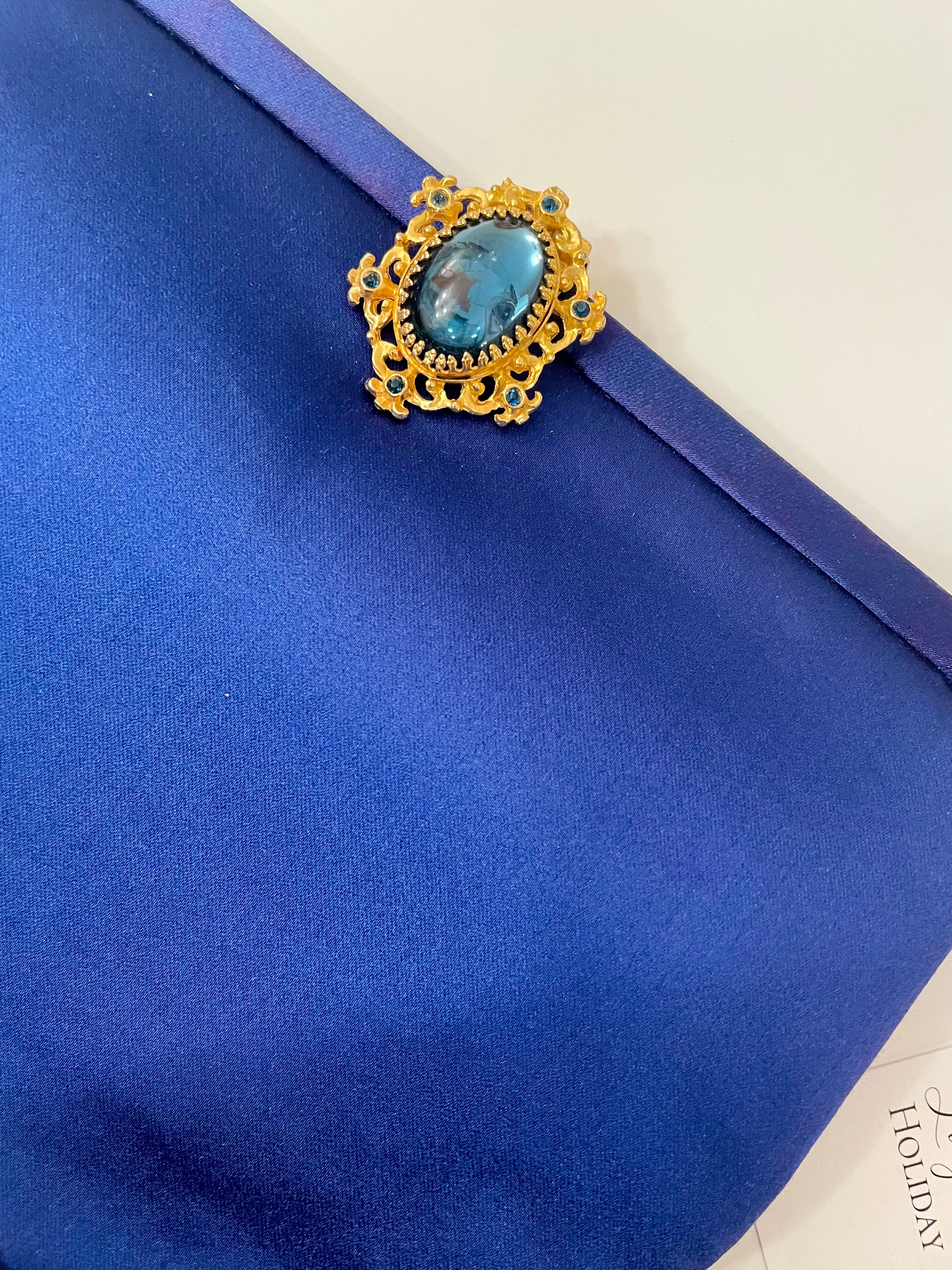 Glamorous and chic, 1960's vintage rich royal blue satin clutch bag, with stunning closure...so elegant