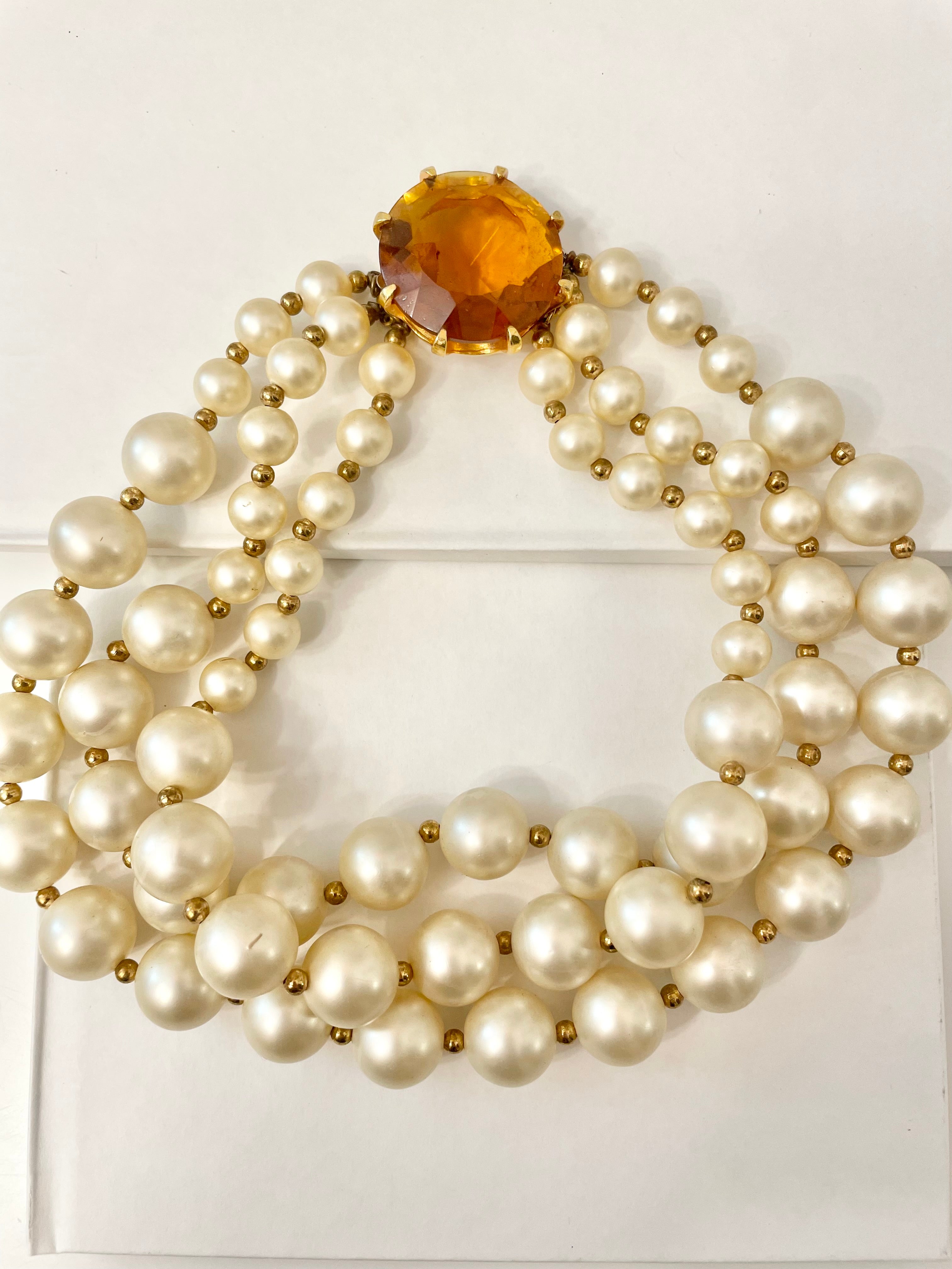 Isn't she Charming.... a fabulous three strand, large pearl necklace... with stunning amber glass clasp. Divine!!