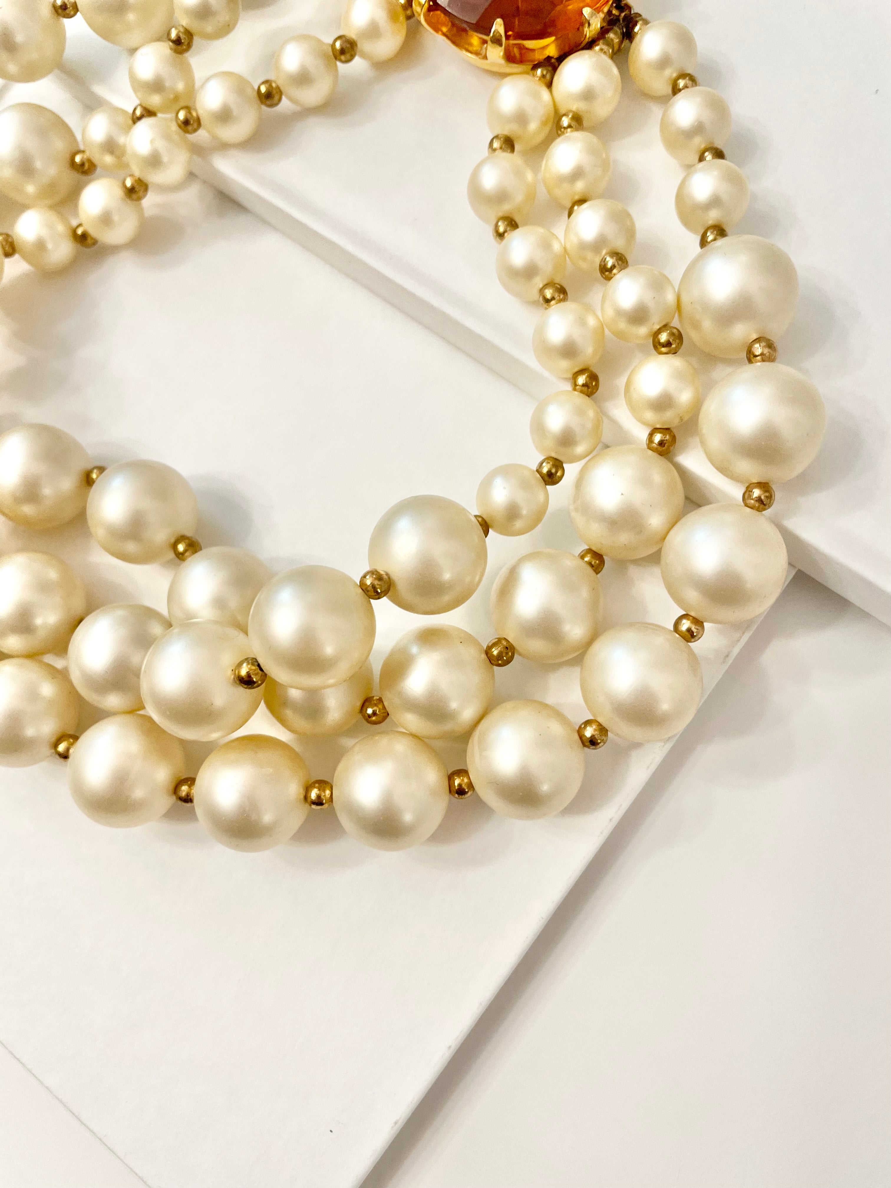 Isn't she Charming.... a fabulous three strand, large pearl necklace... with stunning amber glass clasp. Divine!!