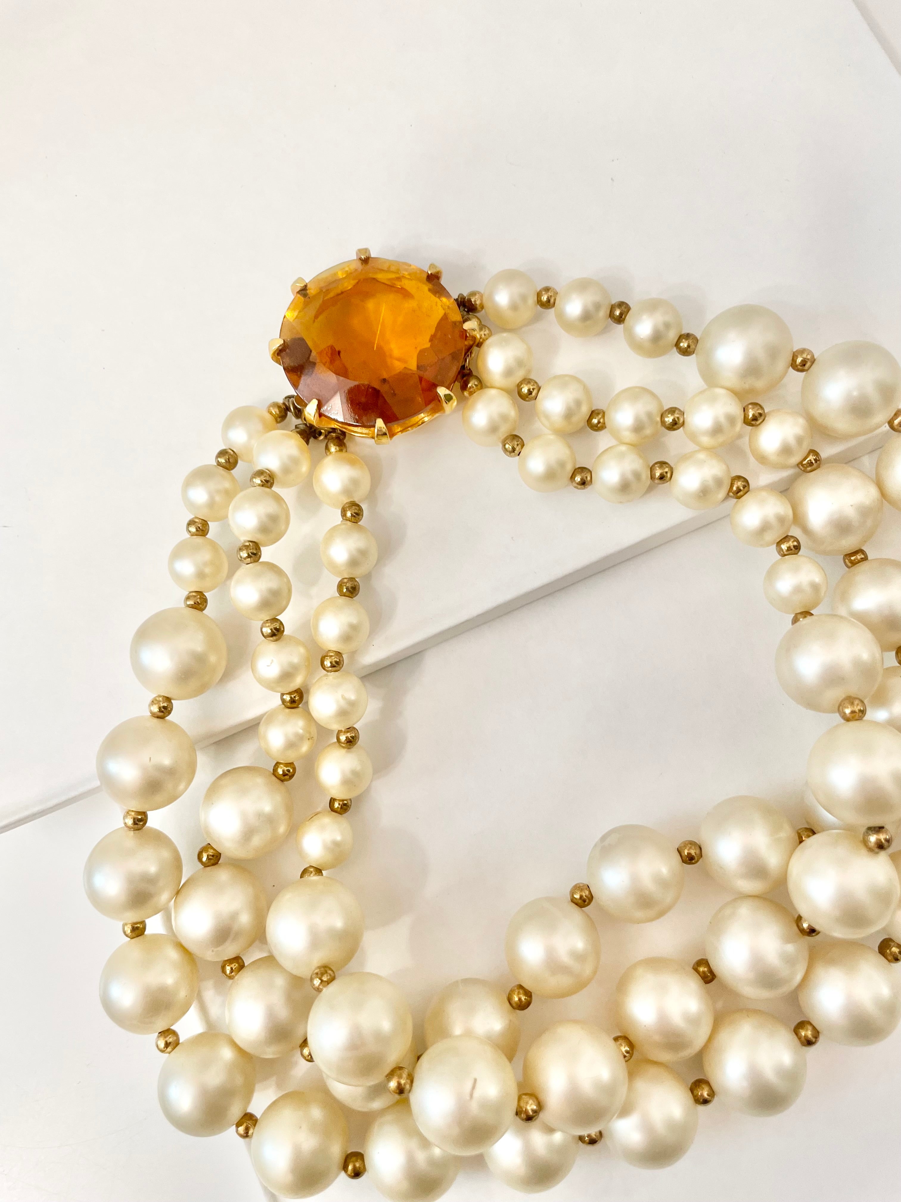 Isn't she Charming.... a fabulous three strand, large pearl necklace... with stunning amber glass clasp. Divine!!