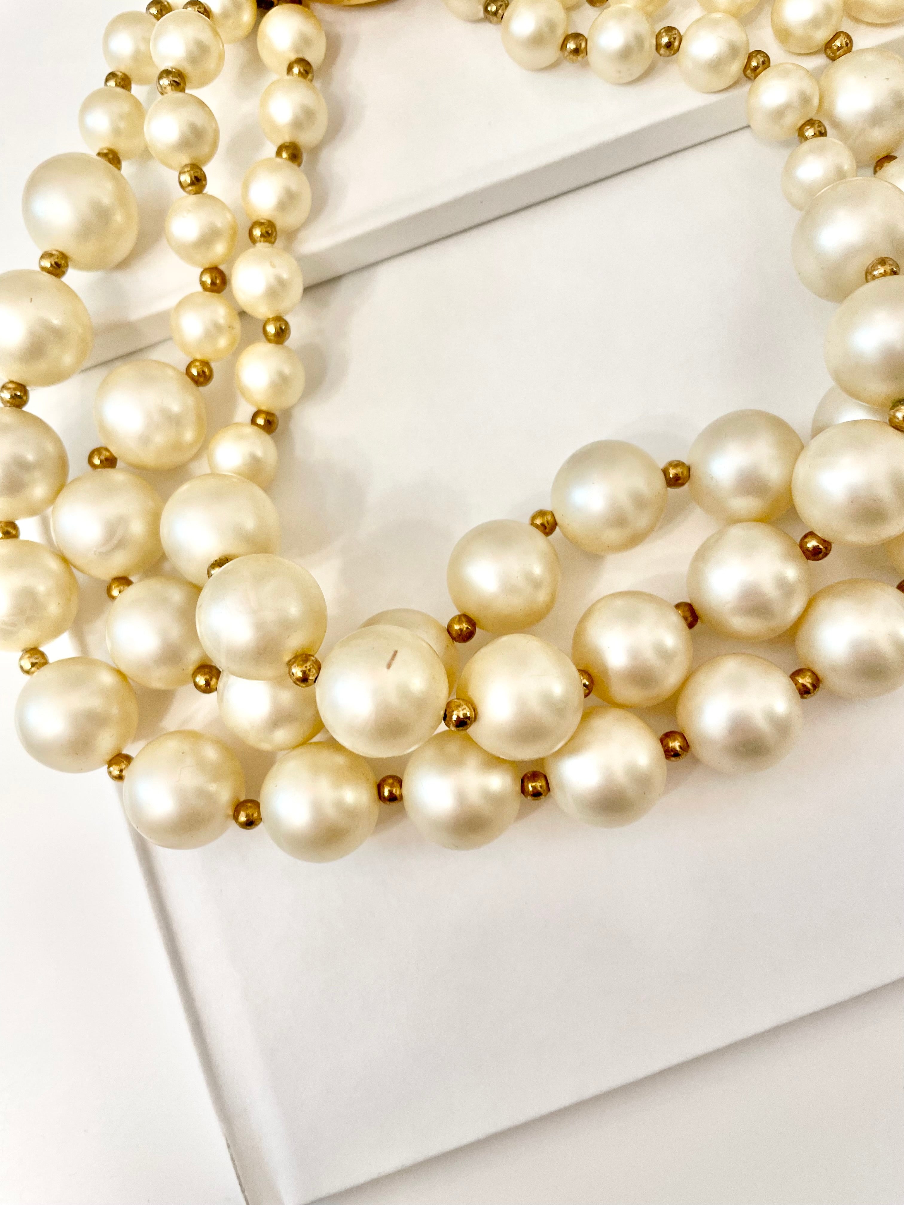 Isn't she Charming.... a fabulous three strand, large pearl necklace... with stunning amber glass clasp. Divine!!