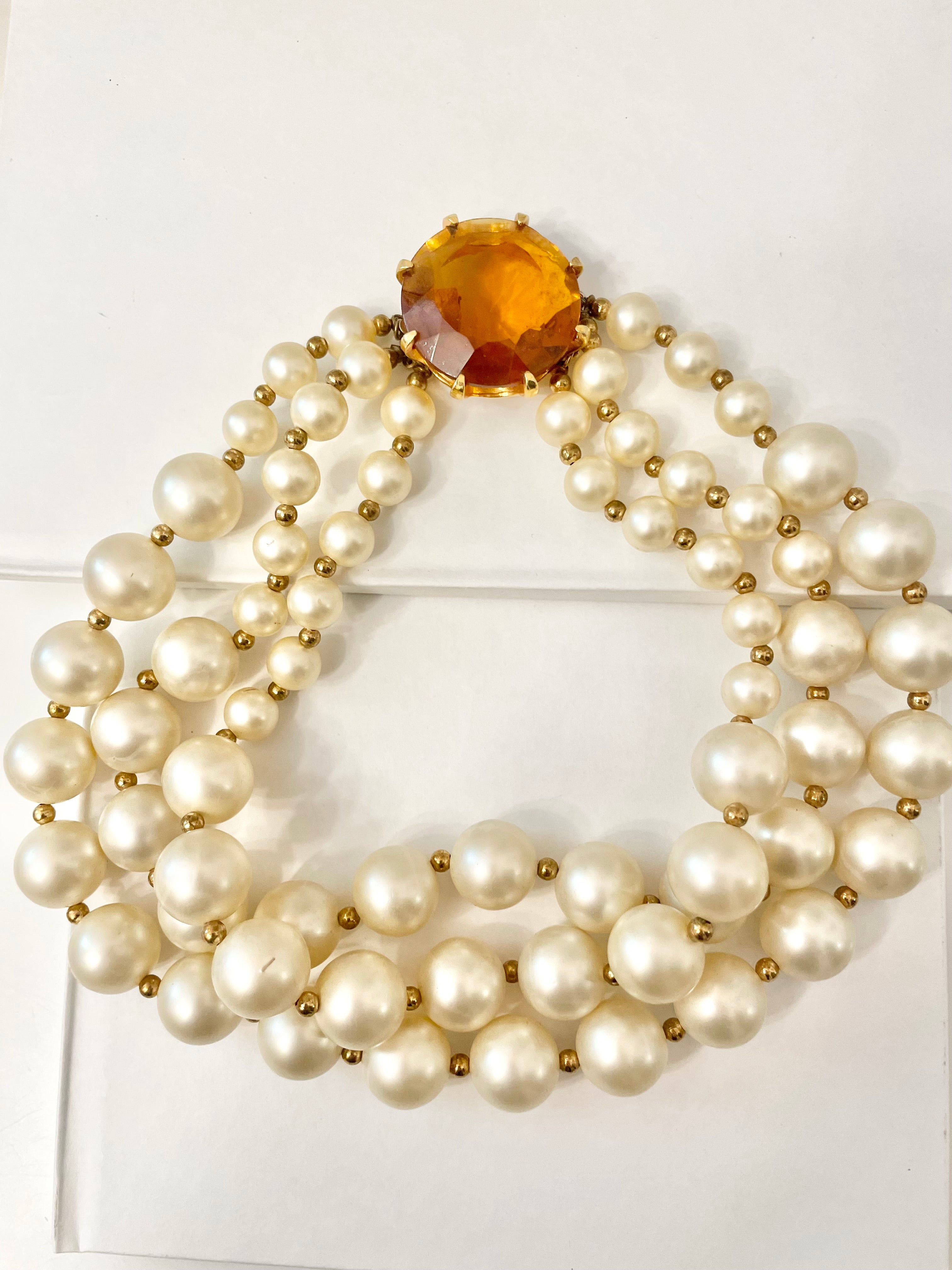 Isn't she Charming.... a fabulous three strand, large pearl necklace... with stunning amber glass clasp. Divine!!