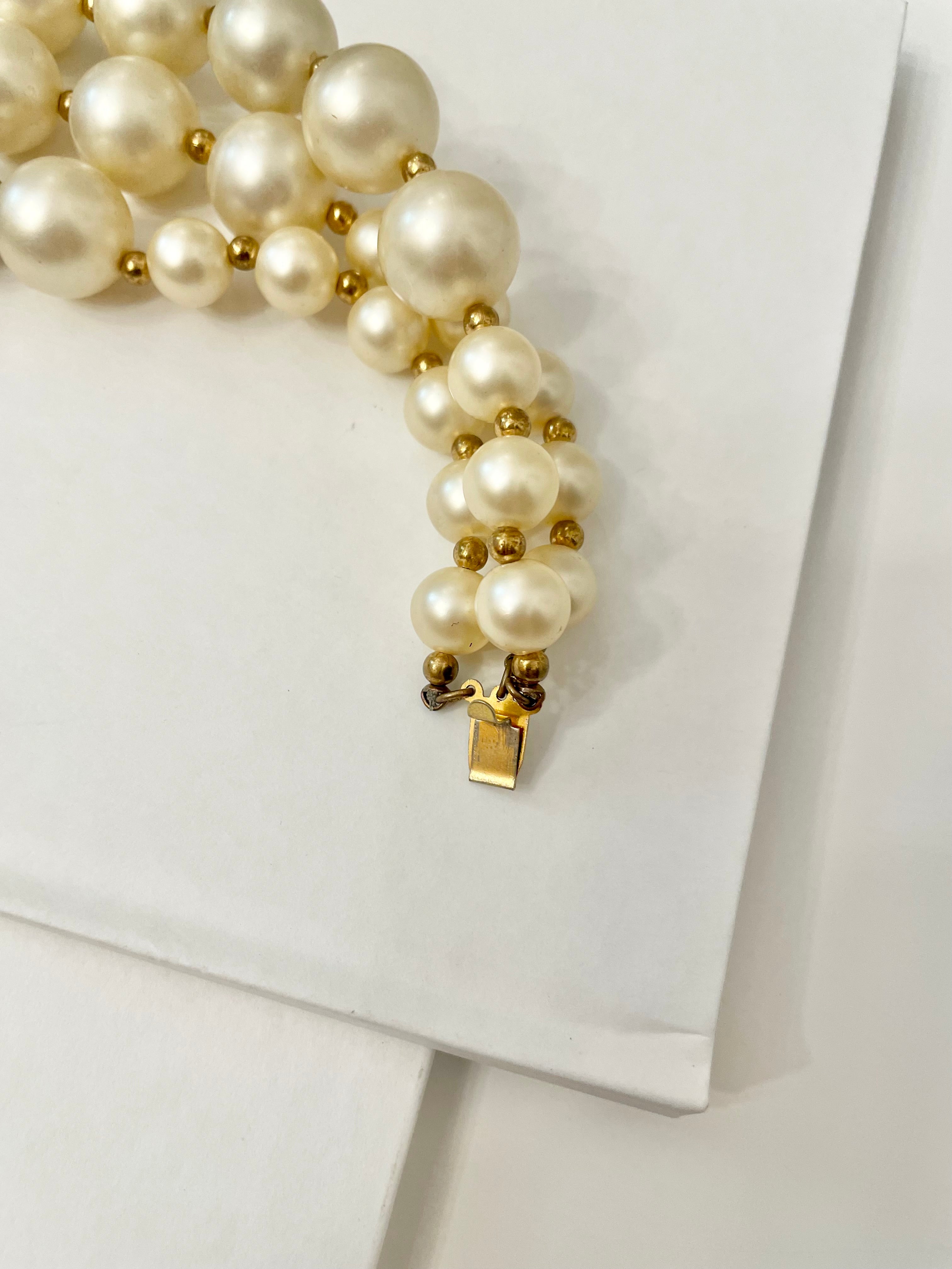 Isn't she Charming.... a fabulous three strand, large pearl necklace... with stunning amber glass clasp. Divine!!