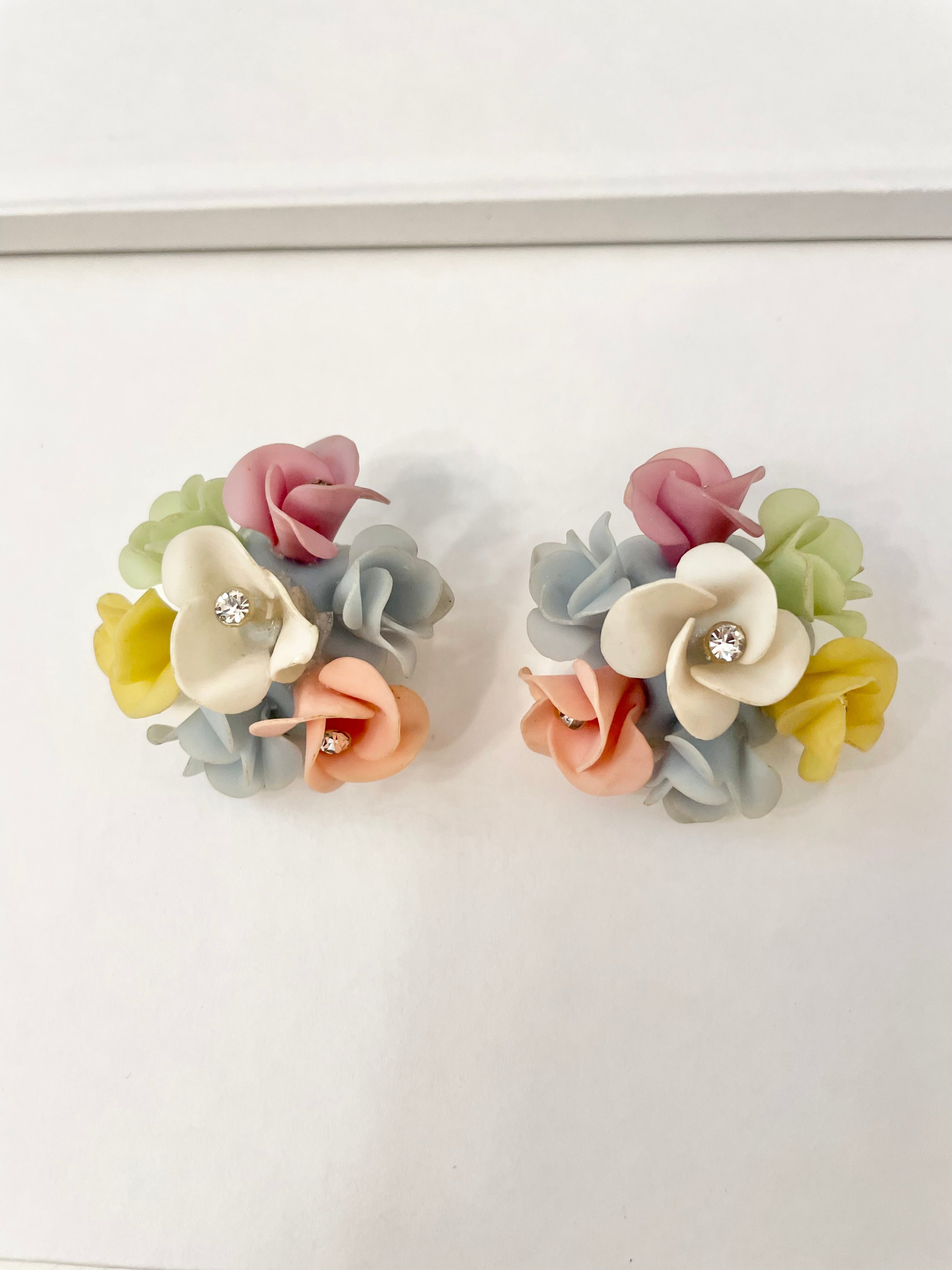 1960's Heiress and her love affair with flower clip on earrings.. the color palette of these are extraordinary!
