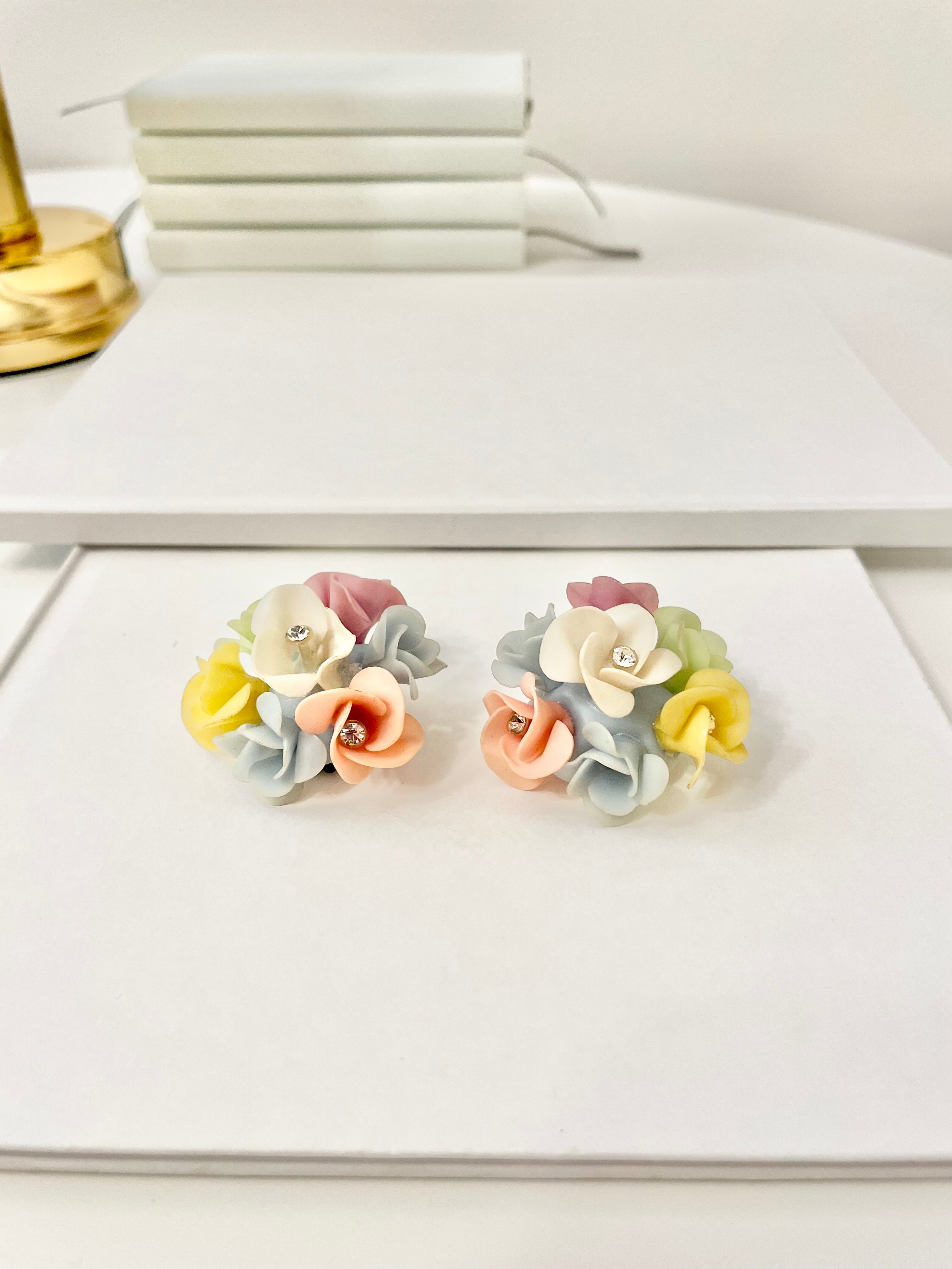 1960's Heiress and her love affair with flower clip on earrings.. the color palette of these are extraordinary!