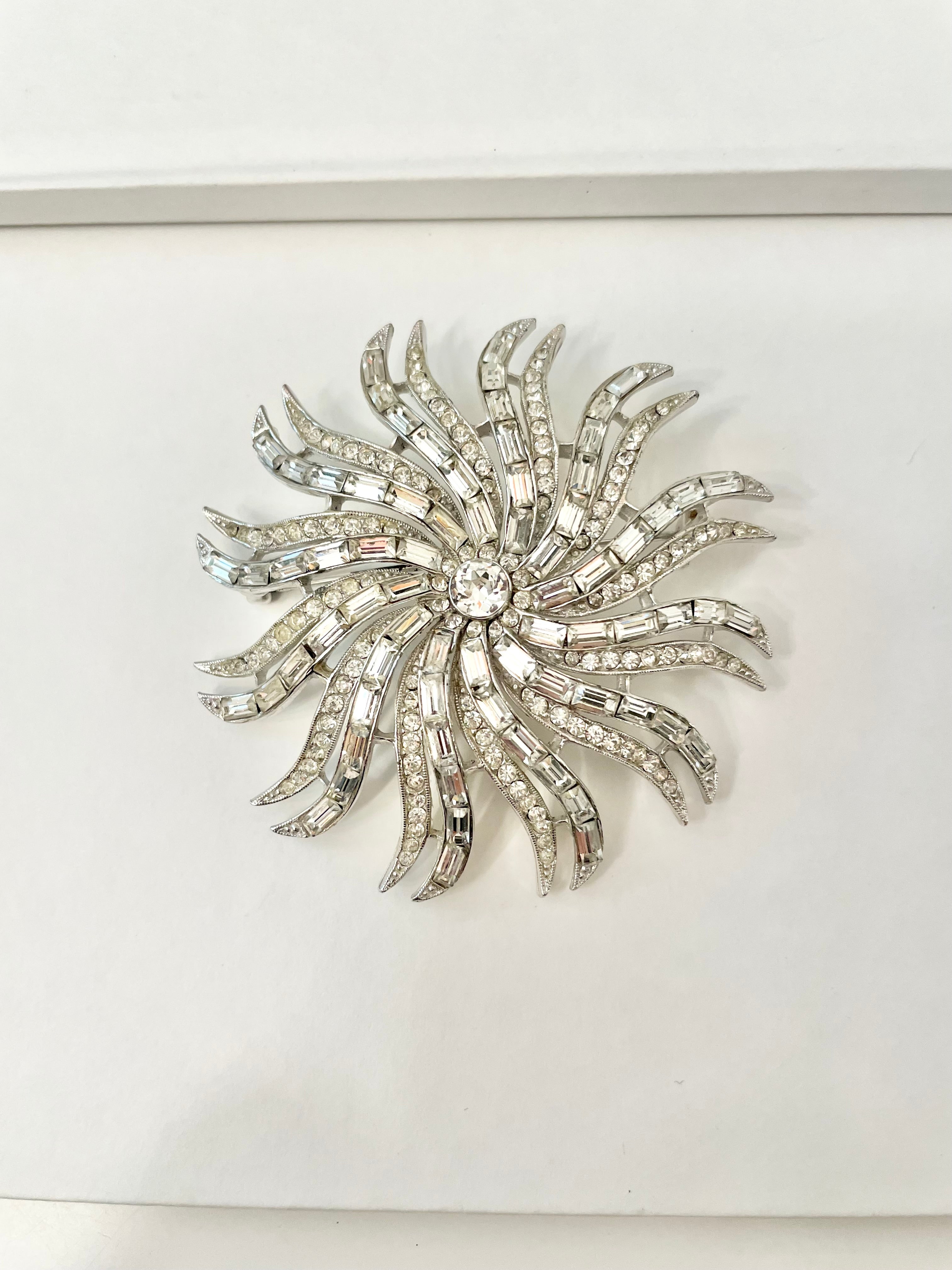 The 1960's Heiress and her diamond collection.. Oh my..this glass starburst brooch is so divine!!