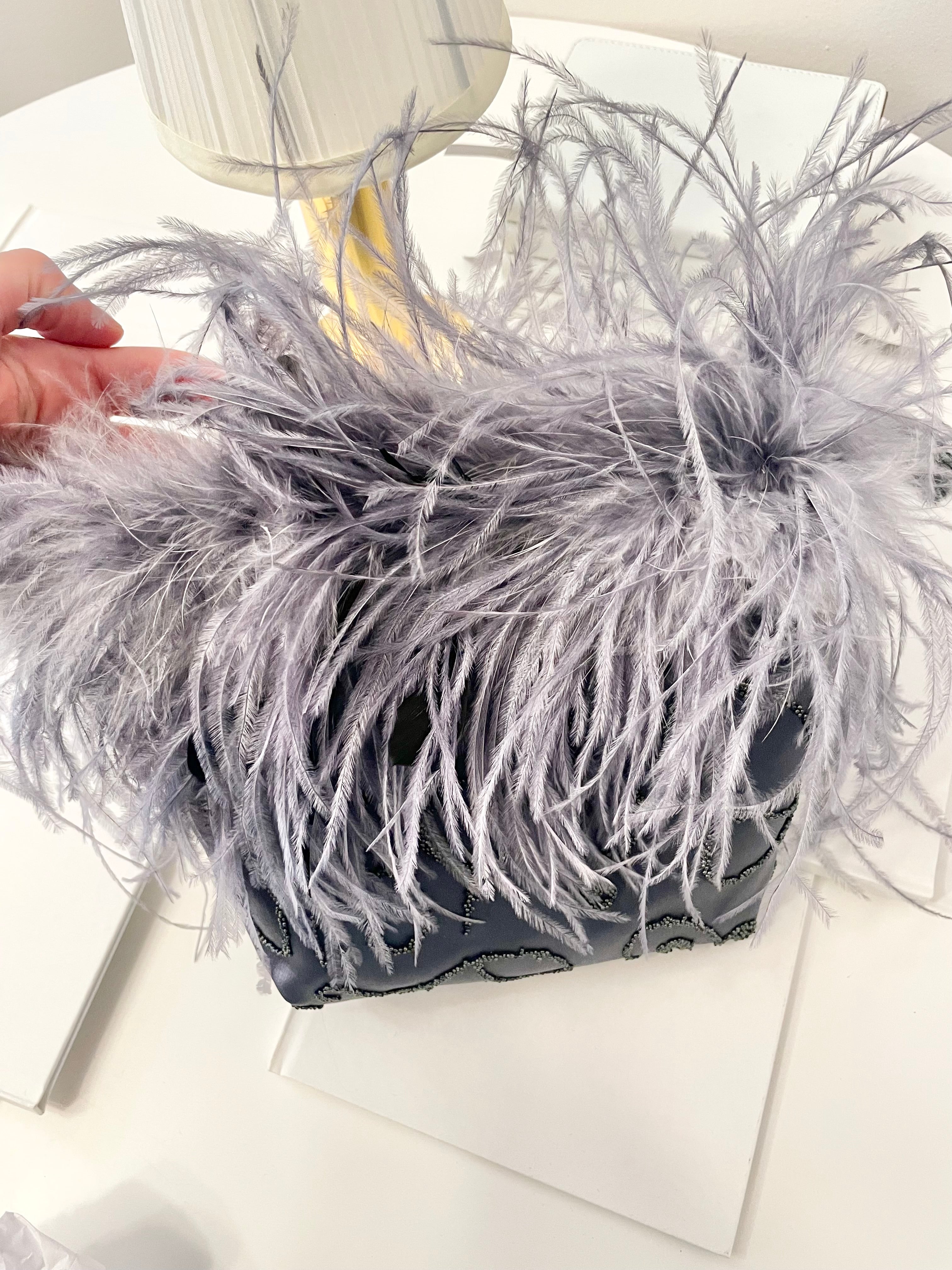 The Cheeky Mistress loves a grand entrance.. When she's wearing her ostrich feather bag, everyones's looking!