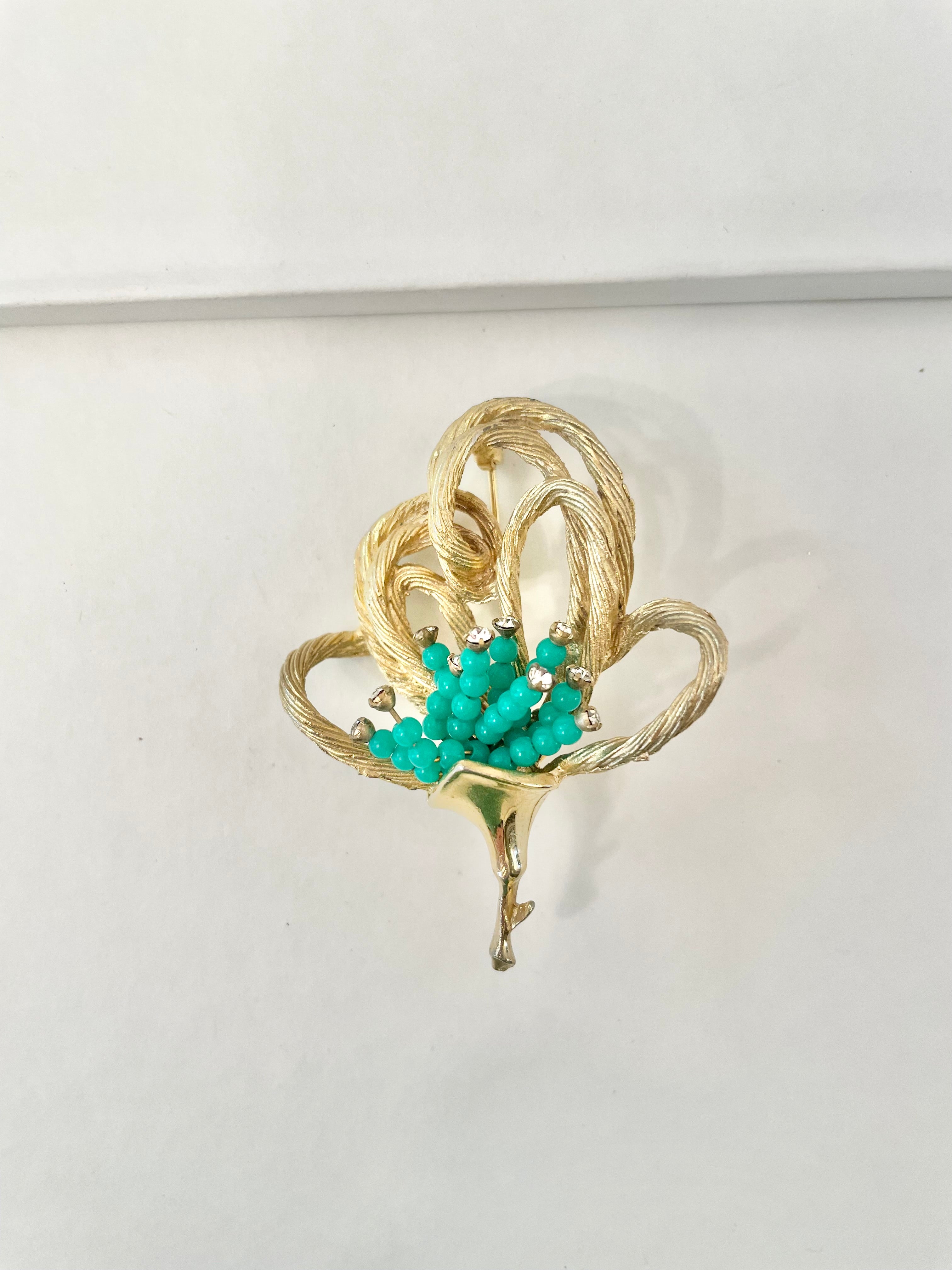 A truly classic brooch for a classy lady... love this bottle green beaded brooch with a sprig of clear glass stones, set in gold! so lovely
