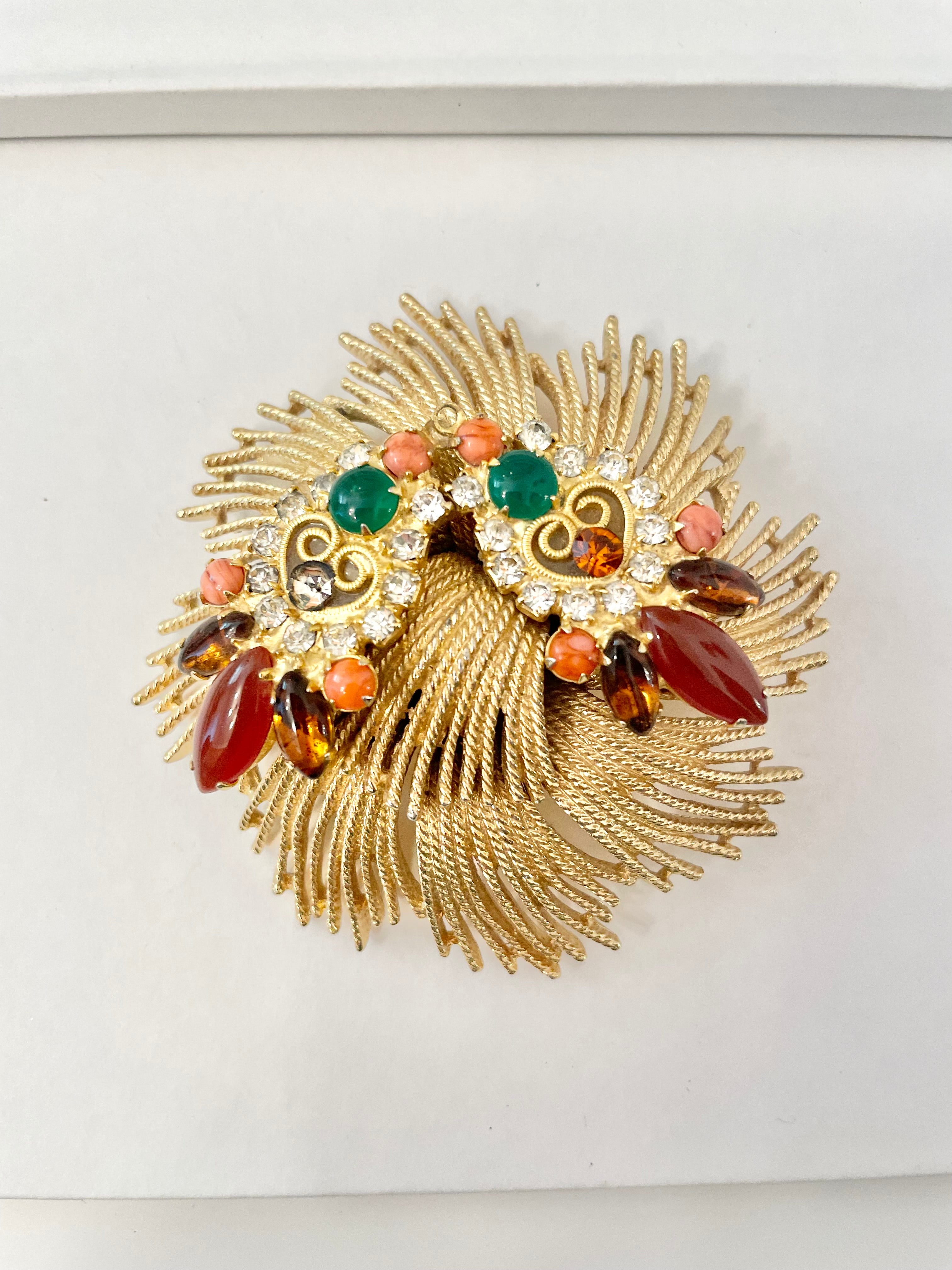 A beautiful rich gold brooch, adorned with the most exquisite color story, coral, green, and carnelian! so chic