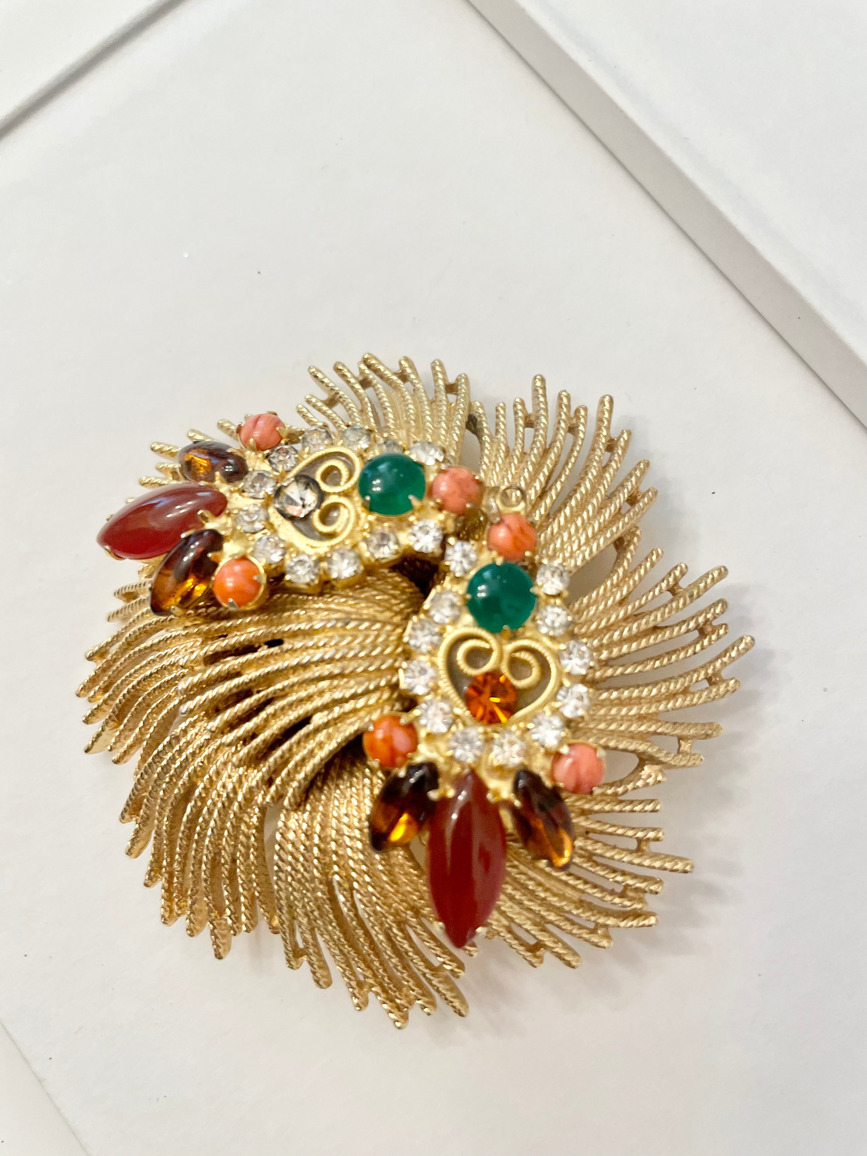 A beautiful rich gold brooch, adorned with the most exquisite color story, coral, green, and carnelian! so chic