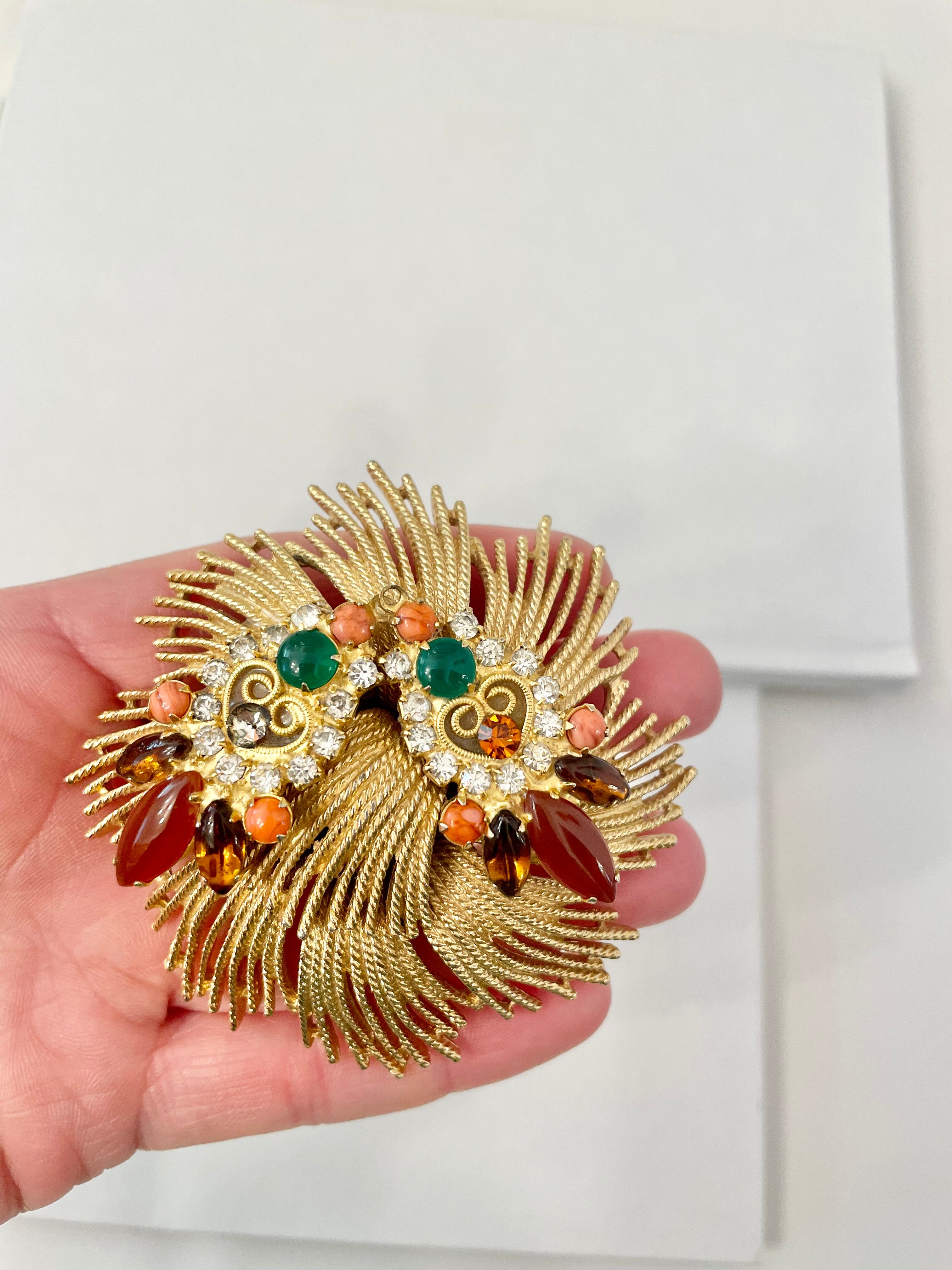 A beautiful rich gold brooch, adorned with the most exquisite color story, coral, green, and carnelian! so chic