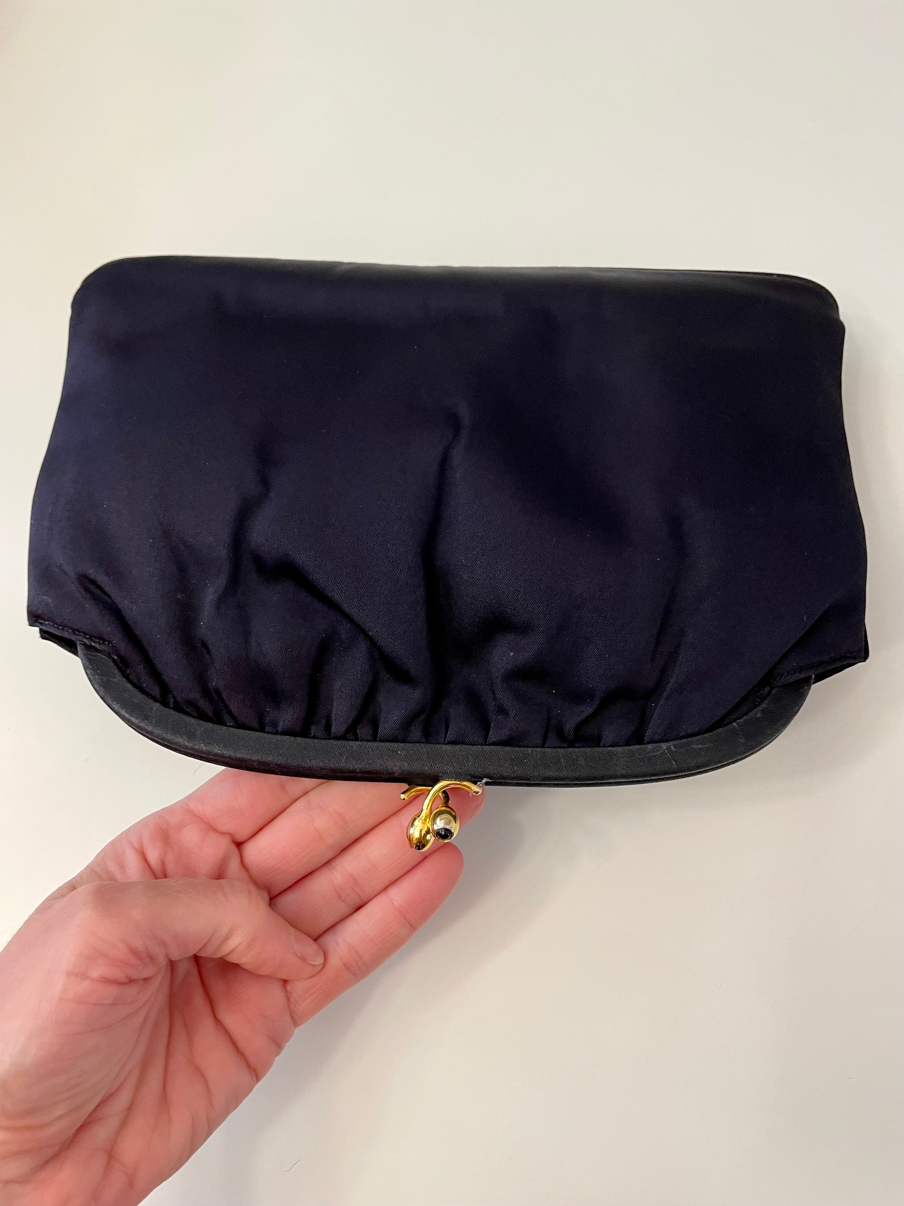 The Socialite and her love of the classic noir satin evening bag... this one is absolutely elegant!