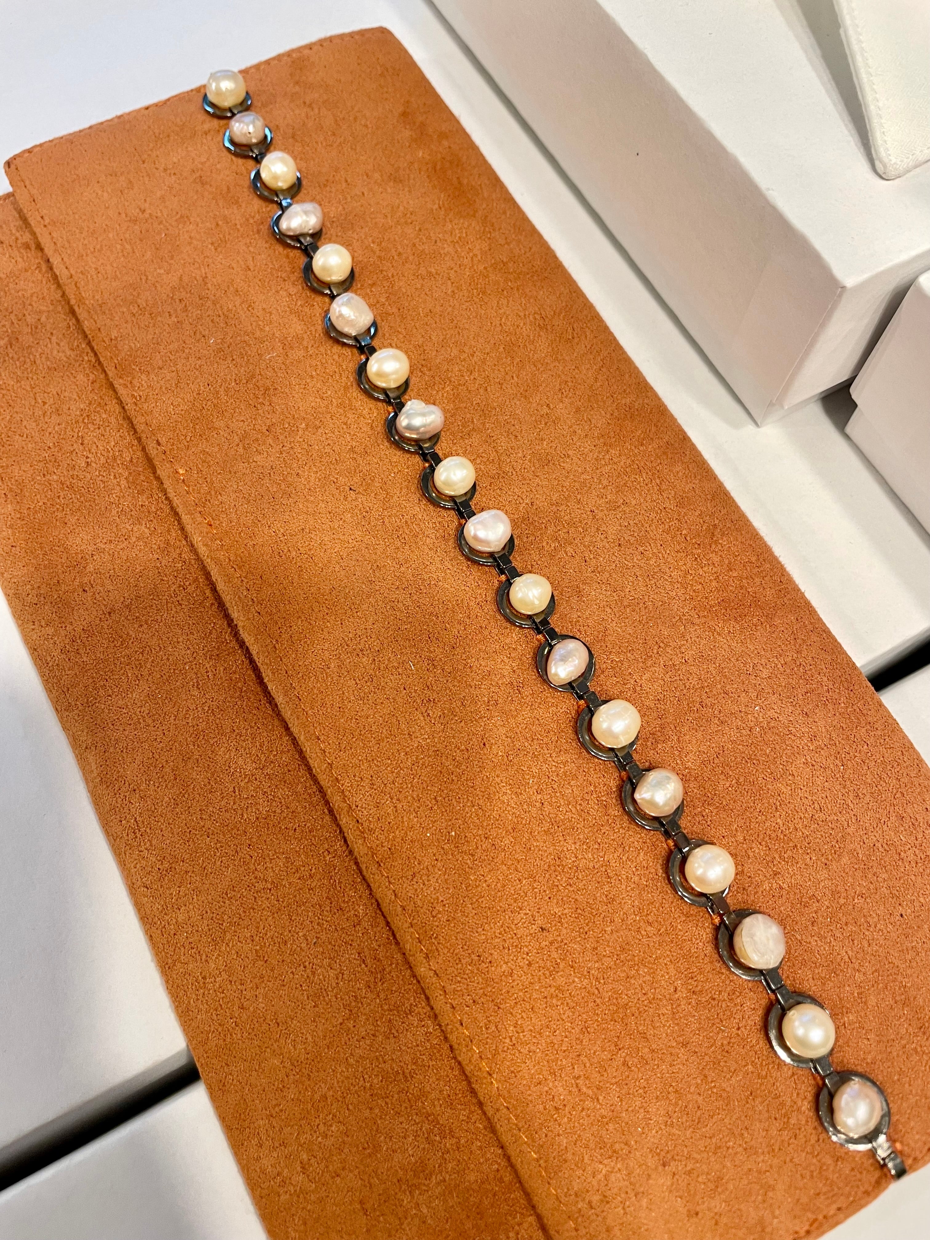 Isn't she Charming... she adores anything with pearls! This one of a kind fresh water pearl clutch, is so chic!