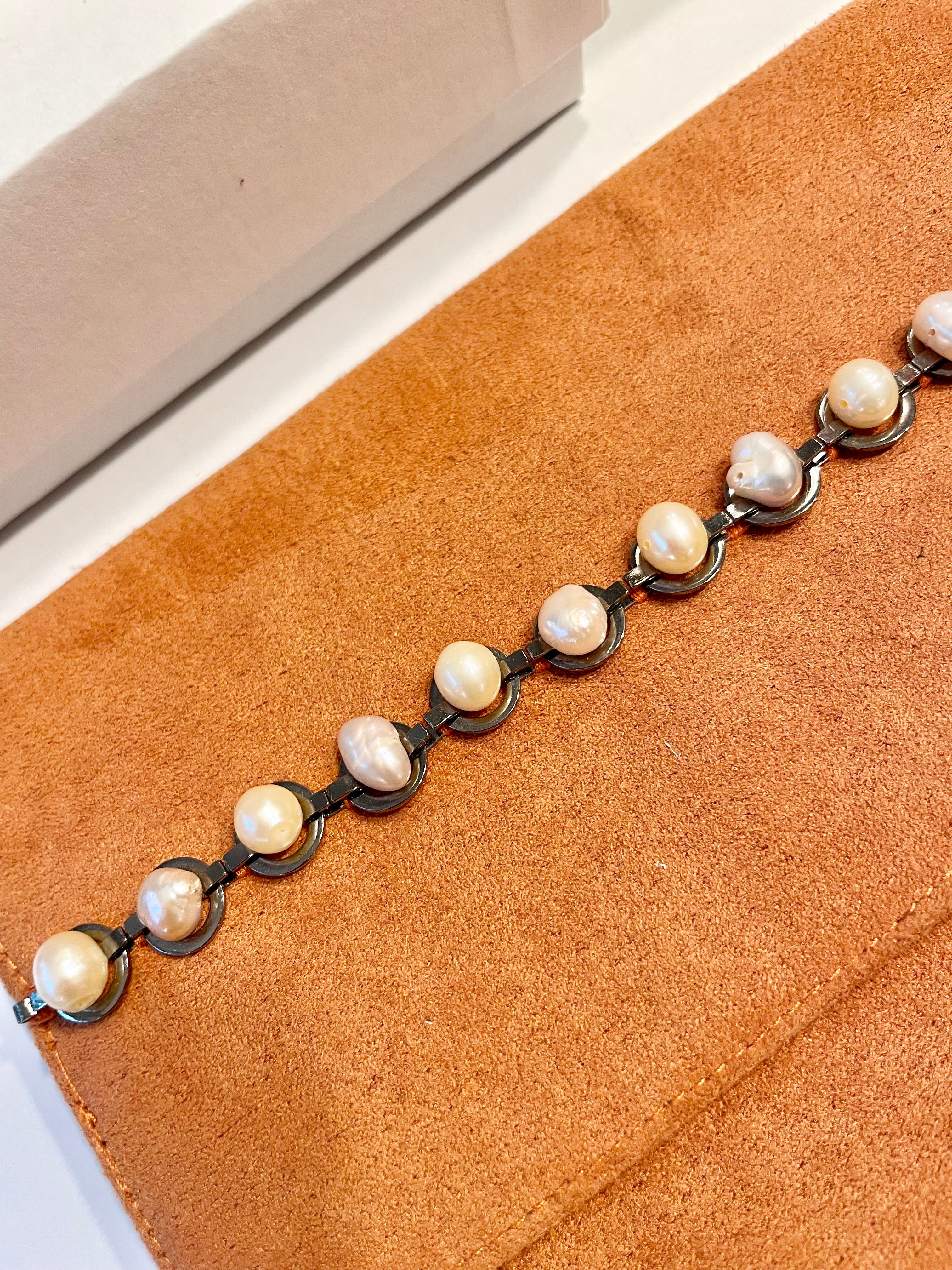 Isn't she Charming... she adores anything with pearls! This one of a kind fresh water pearl clutch, is so chic!