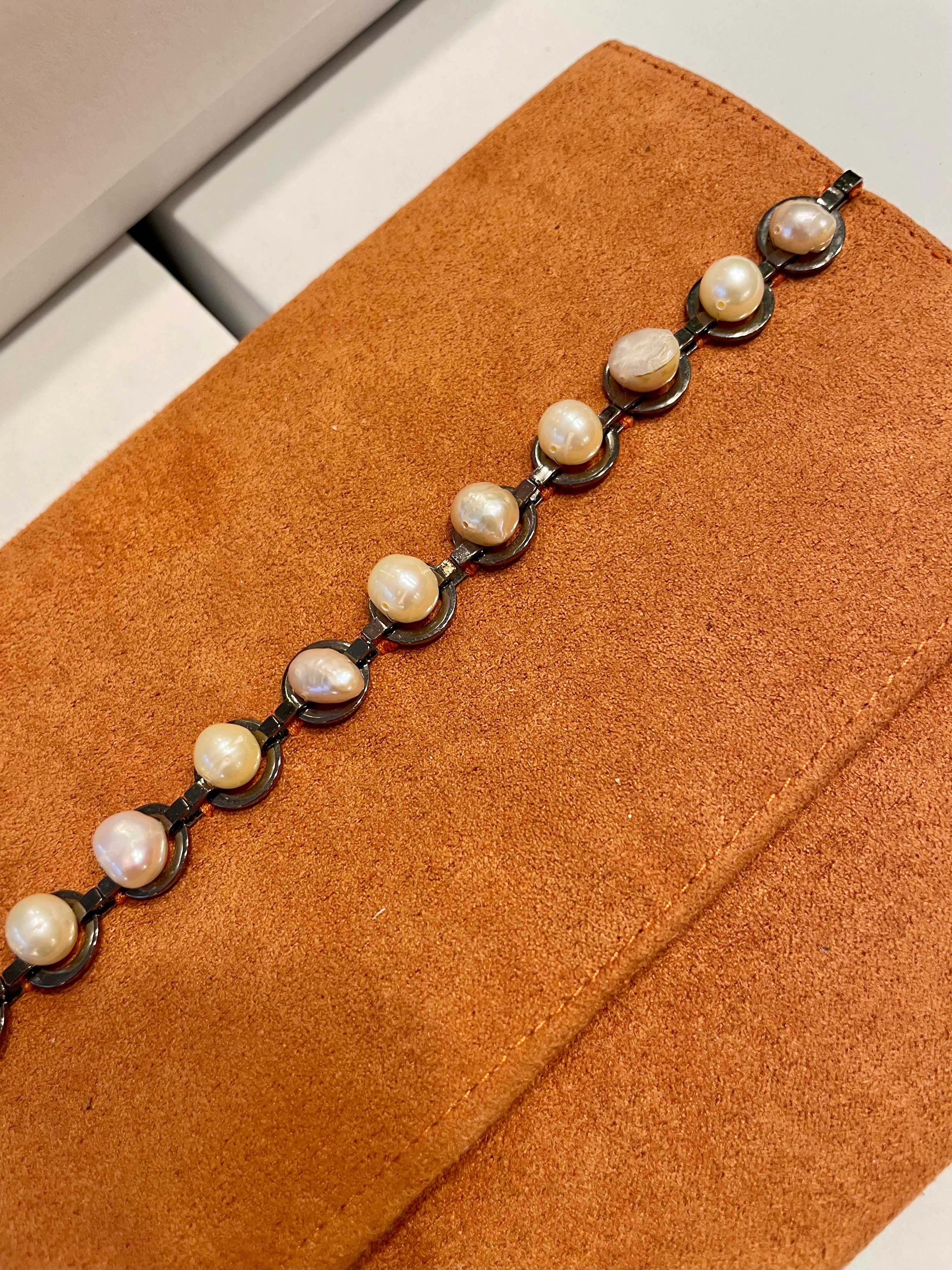 Isn't she Charming... she adores anything with pearls! This one of a kind fresh water pearl clutch, is so chic!