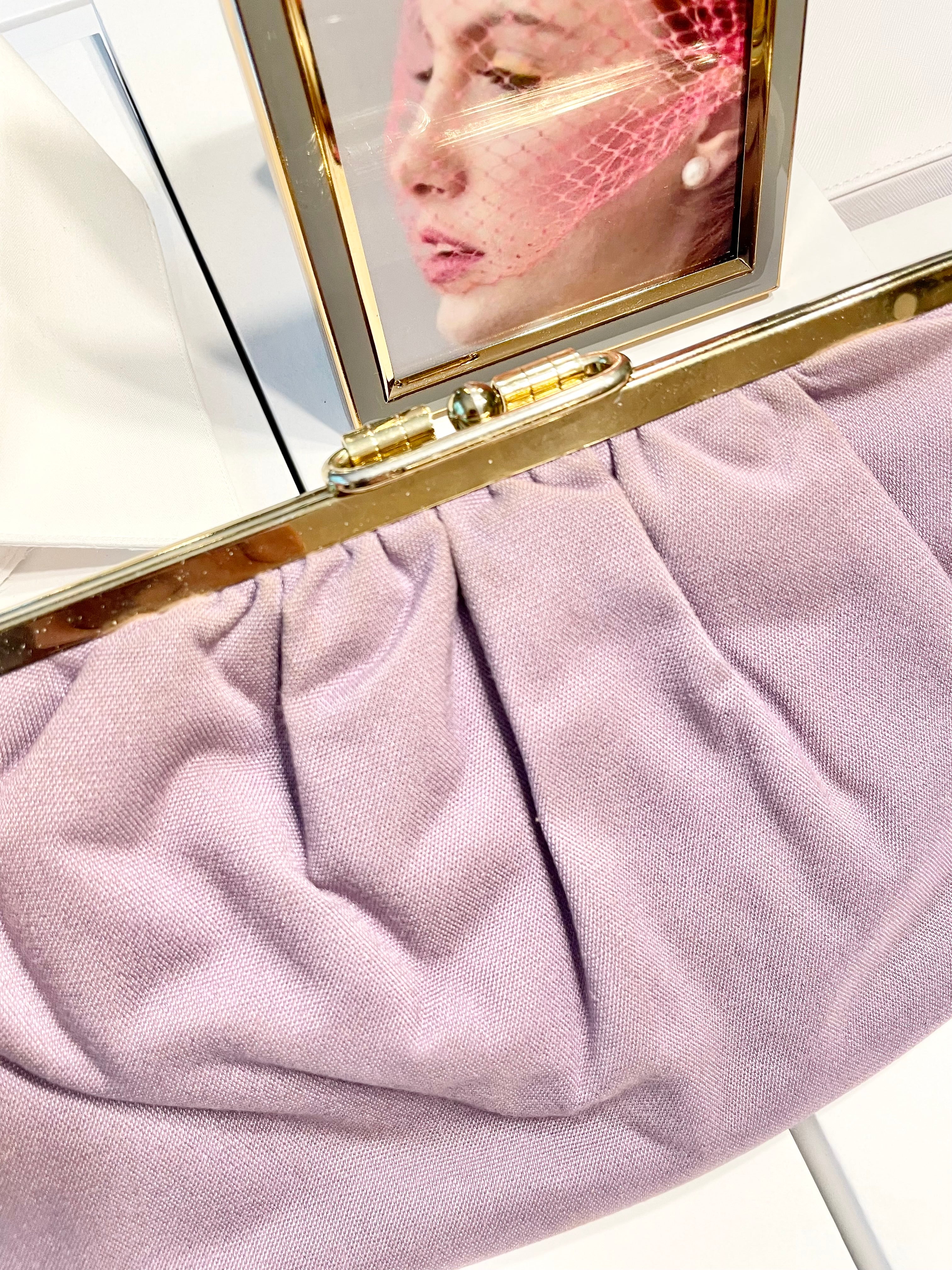 The Happy Hostess loves anything colorful! She does this feminine lilac linen colored clutch bag... so snazzy!