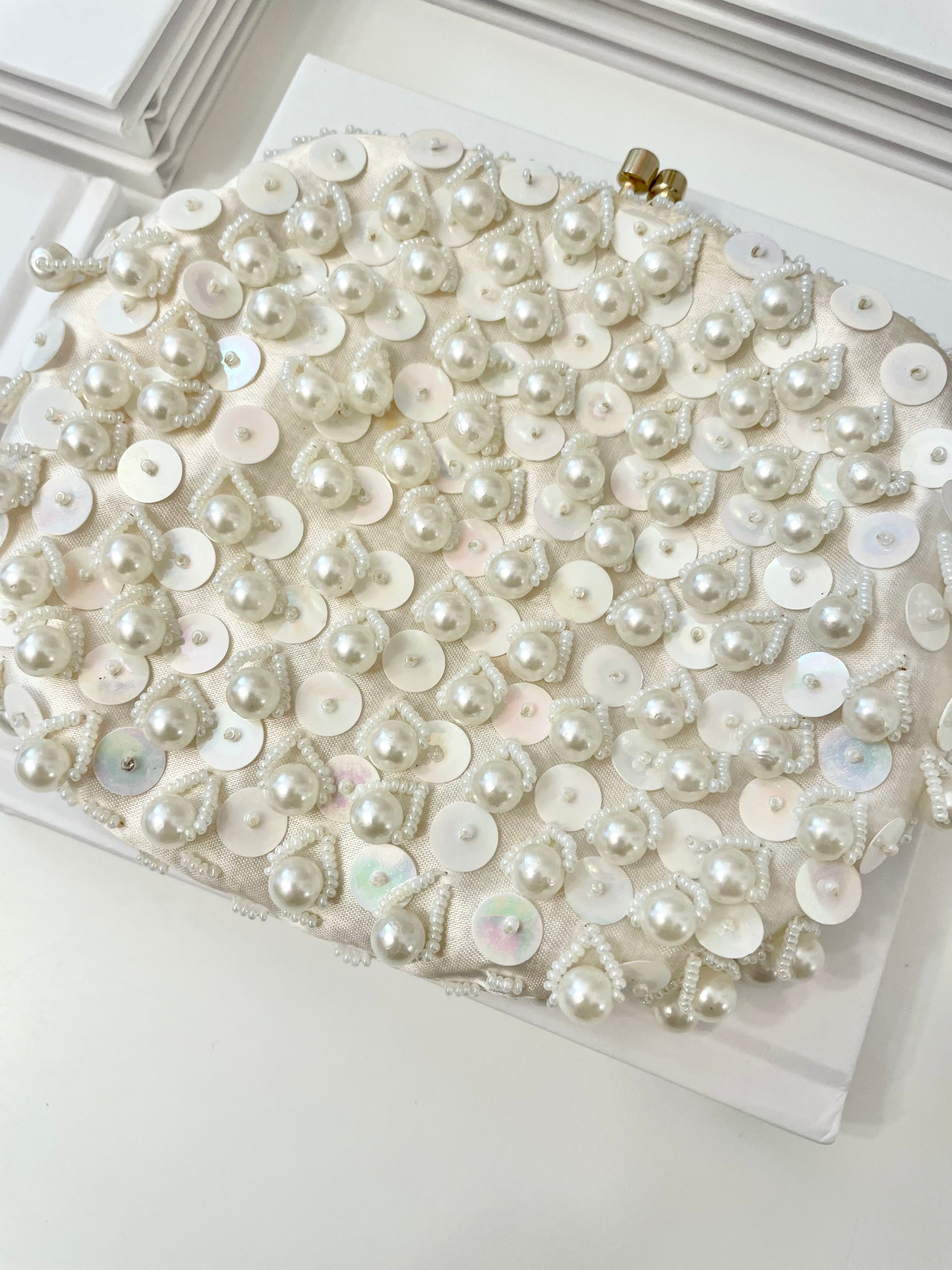 This 1960's classy pearl cha cha evening bag... is a must for any lady!