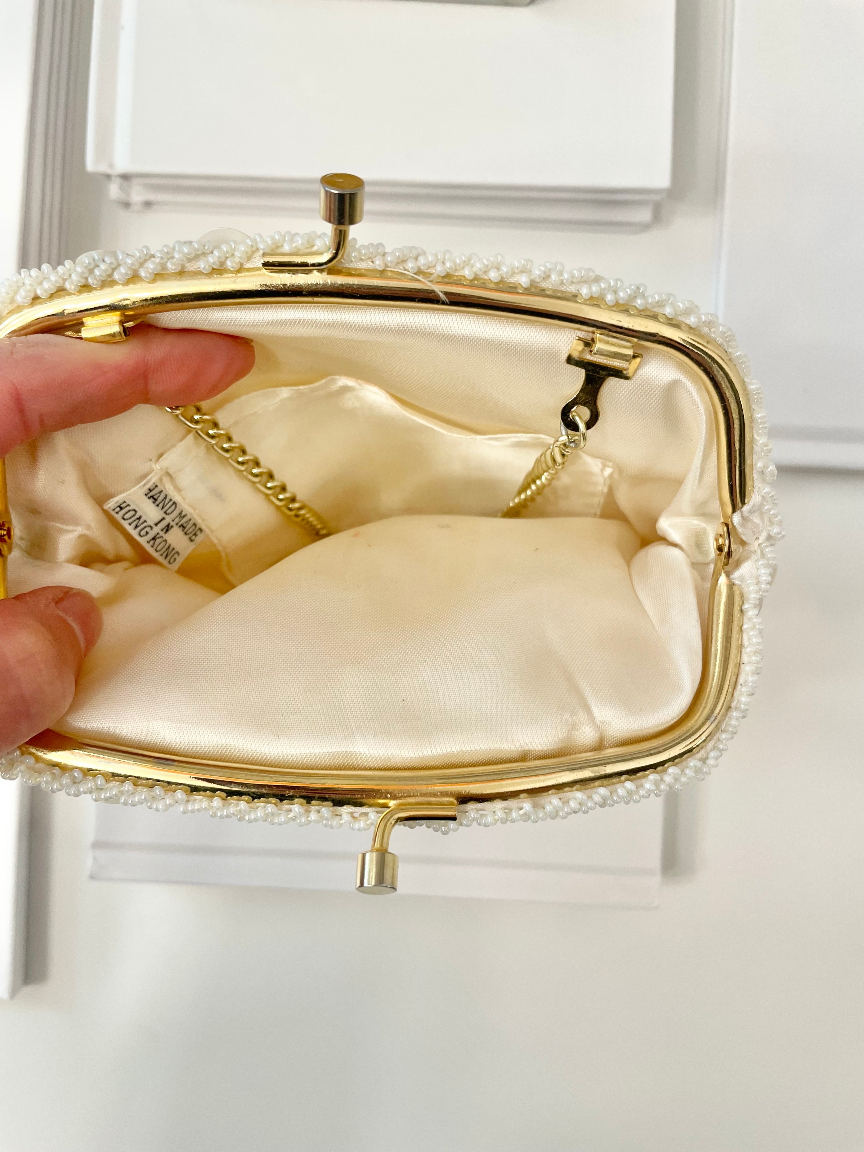 This 1960's classy pearl cha cha evening bag... is a must for any lady!