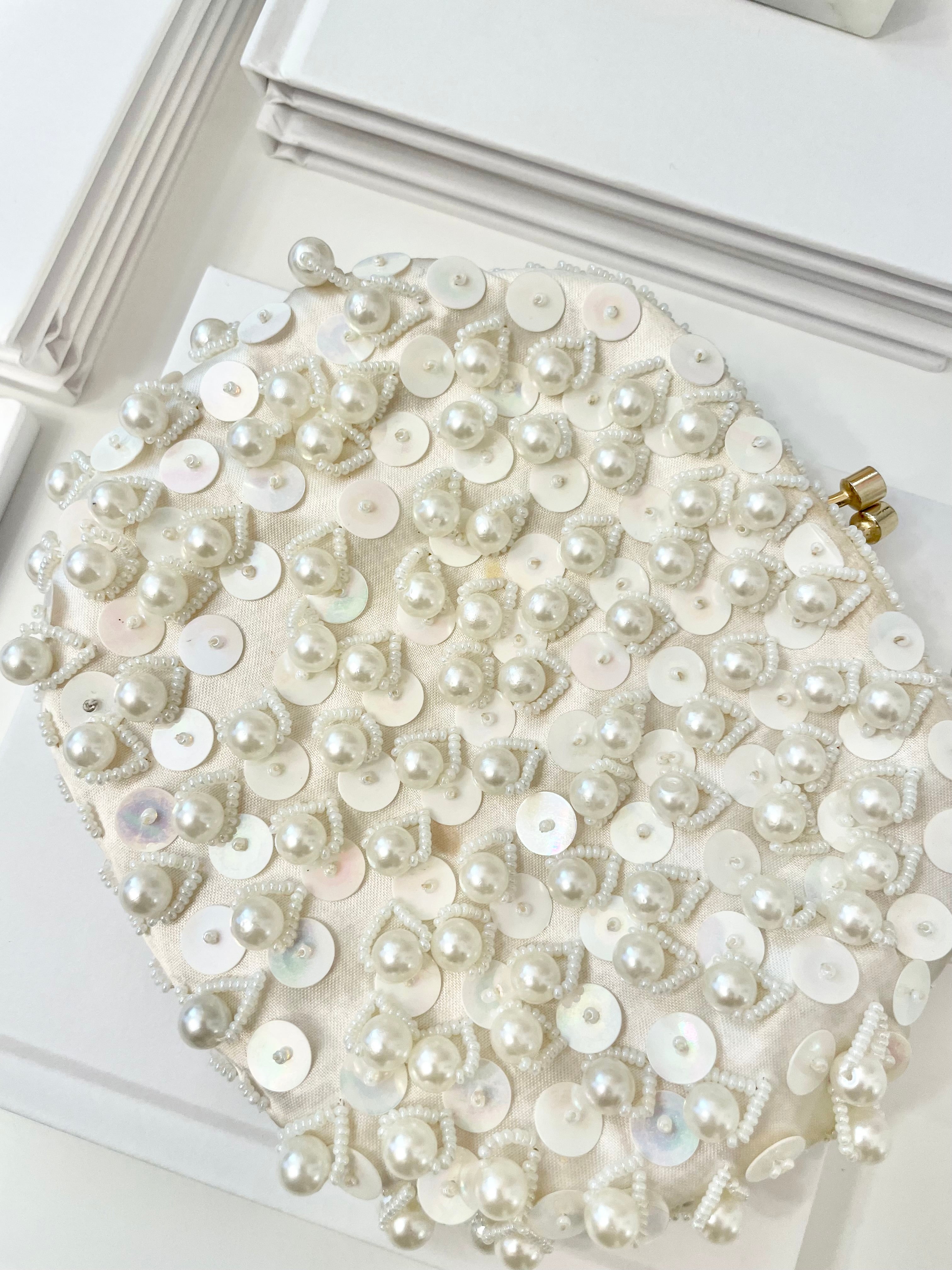 This 1960's classy pearl cha cha evening bag... is a must for any lady!