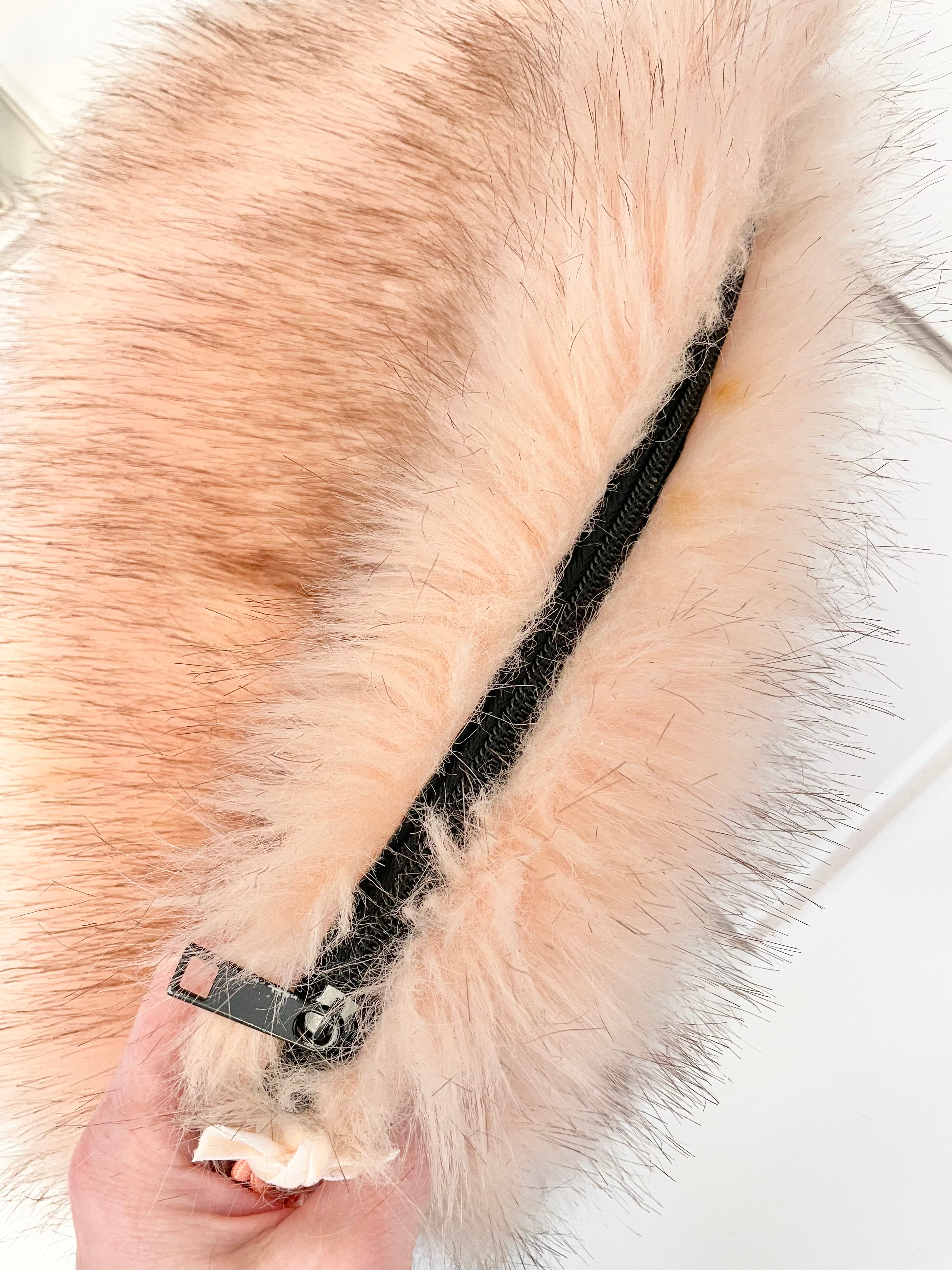 The most lovely blush faux fur clutch bag! So feminine...