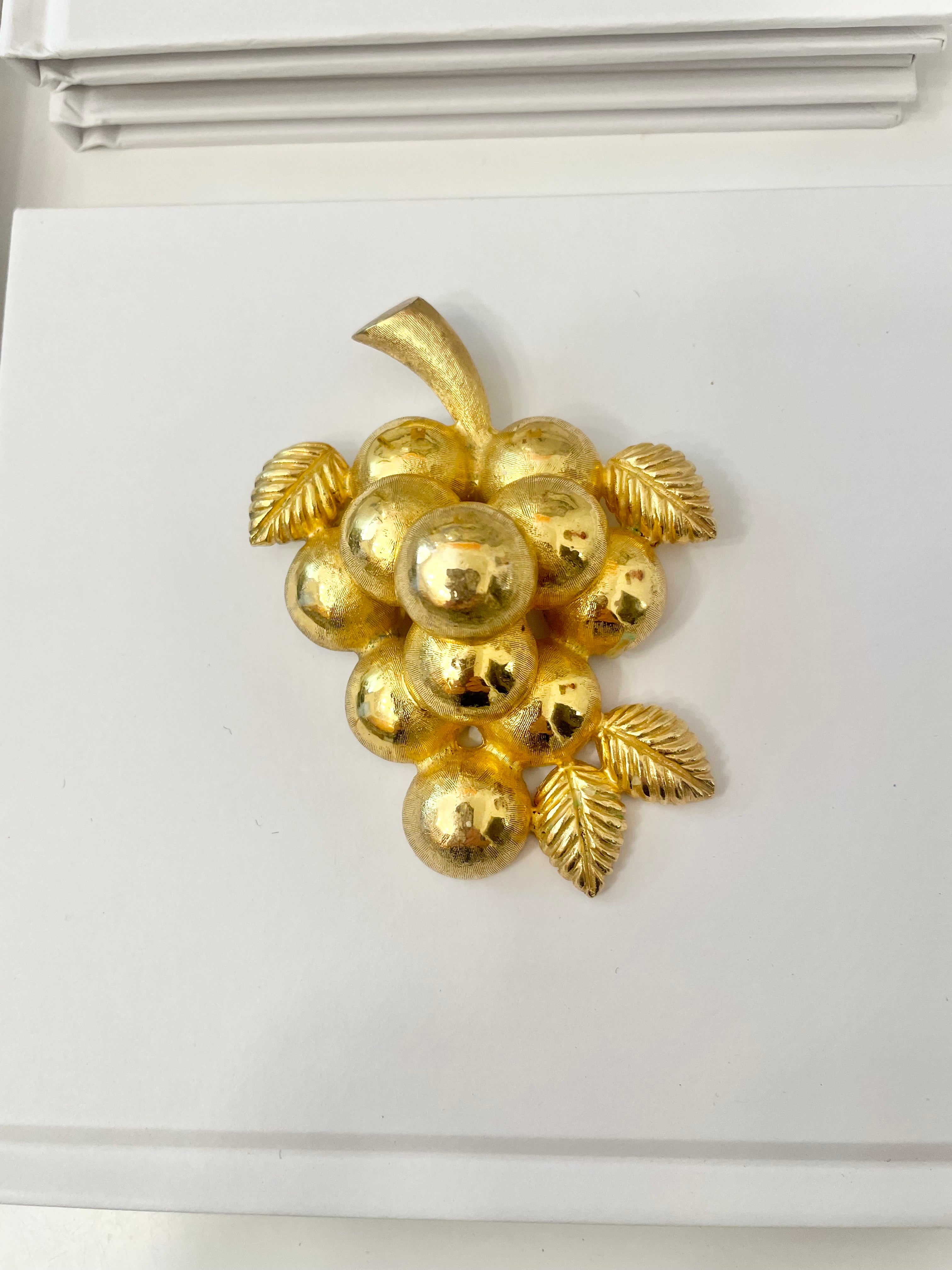 A truly special piece... a rare Judith Leiber heavy gold, sculptural brooch... So chic!