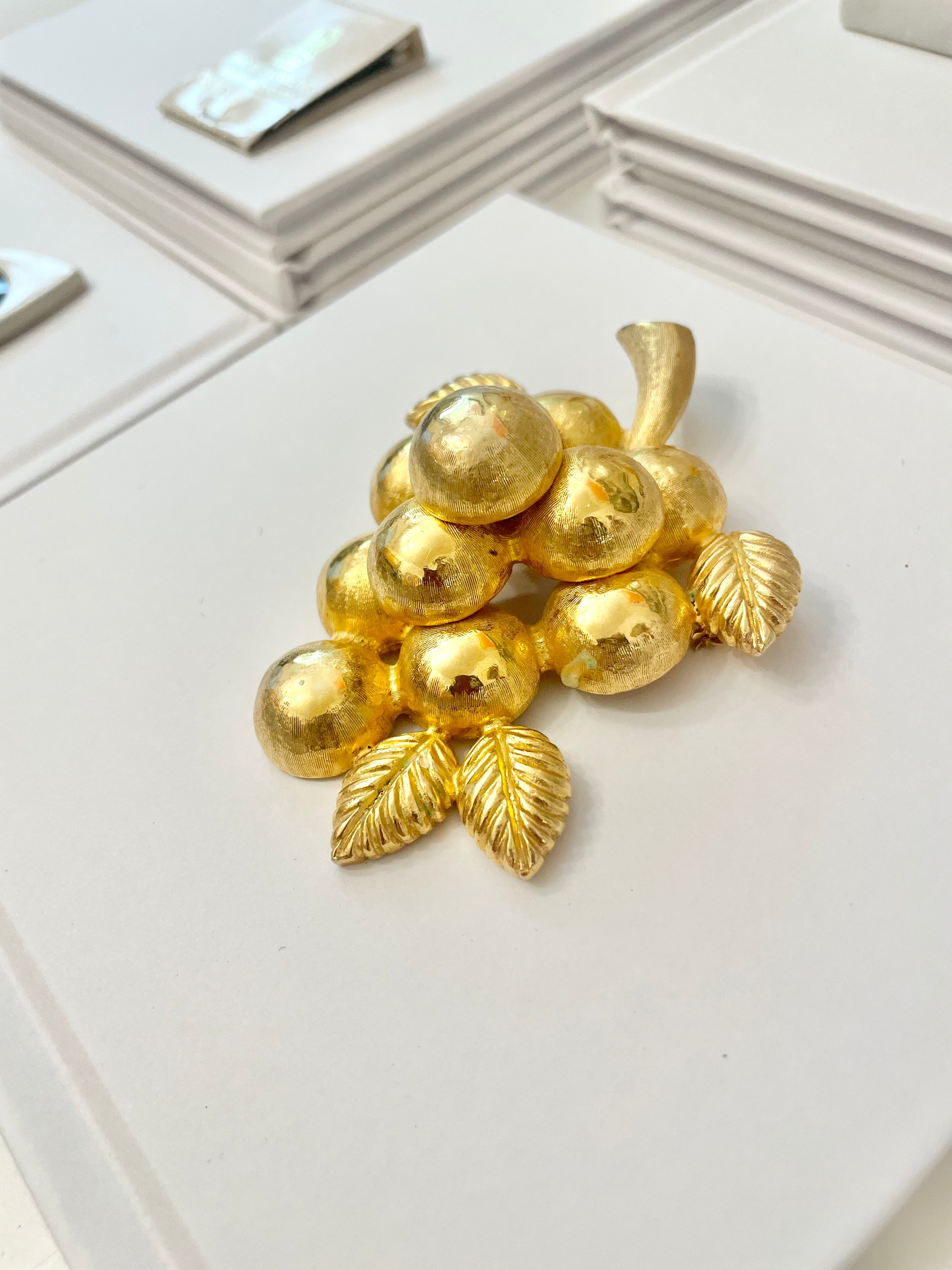A truly special piece... a rare Judith Leiber heavy gold, sculptural brooch... So chic!