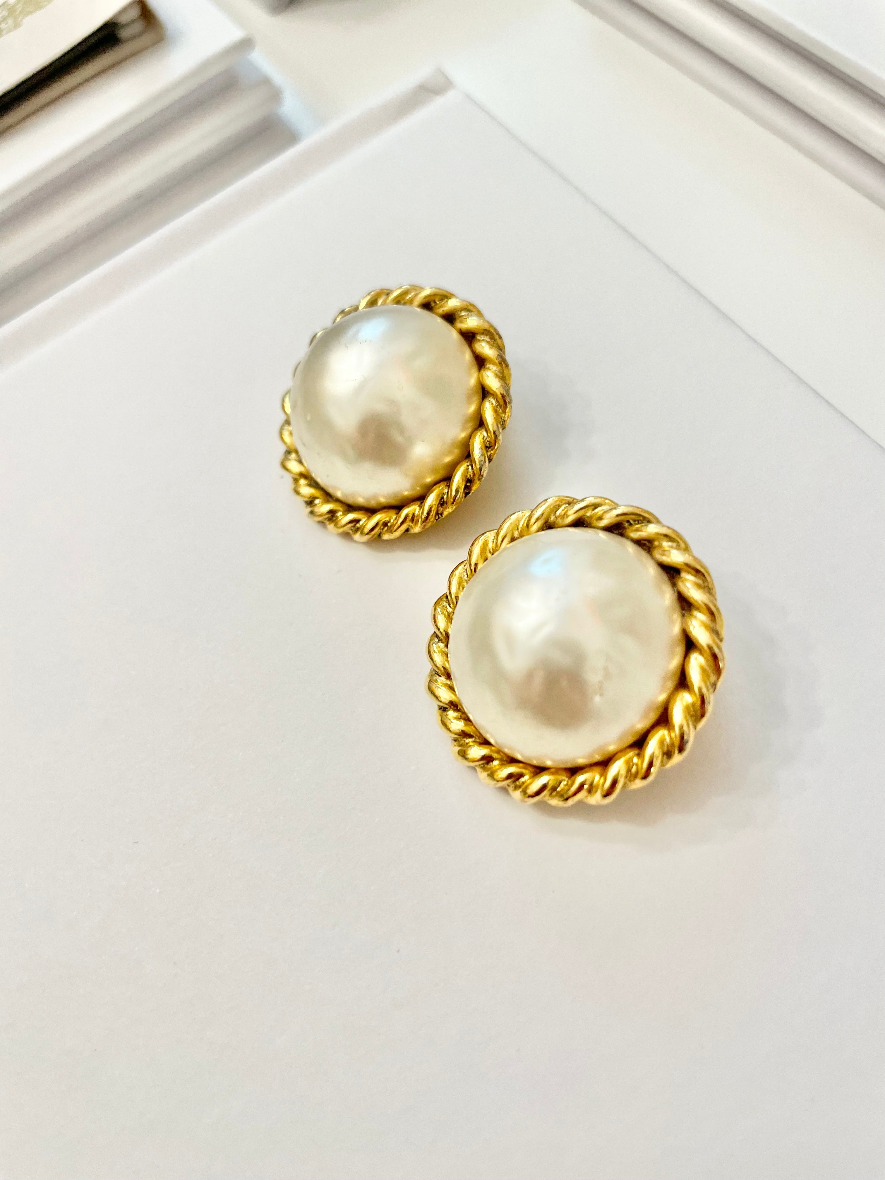 Truly classy Carol Lee stunning pearl clip earrings, framed in a braided gold! Timeless design..