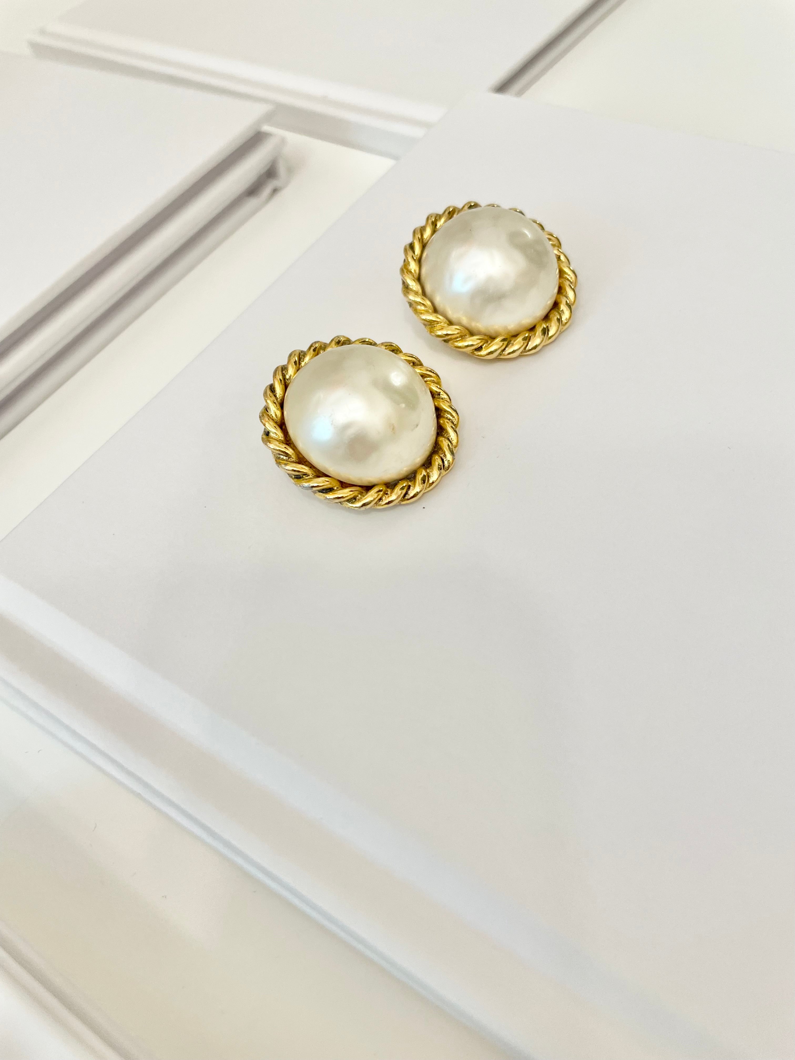 Truly classy Carol Lee stunning pearl clip earrings, framed in a braided gold! Timeless design..
