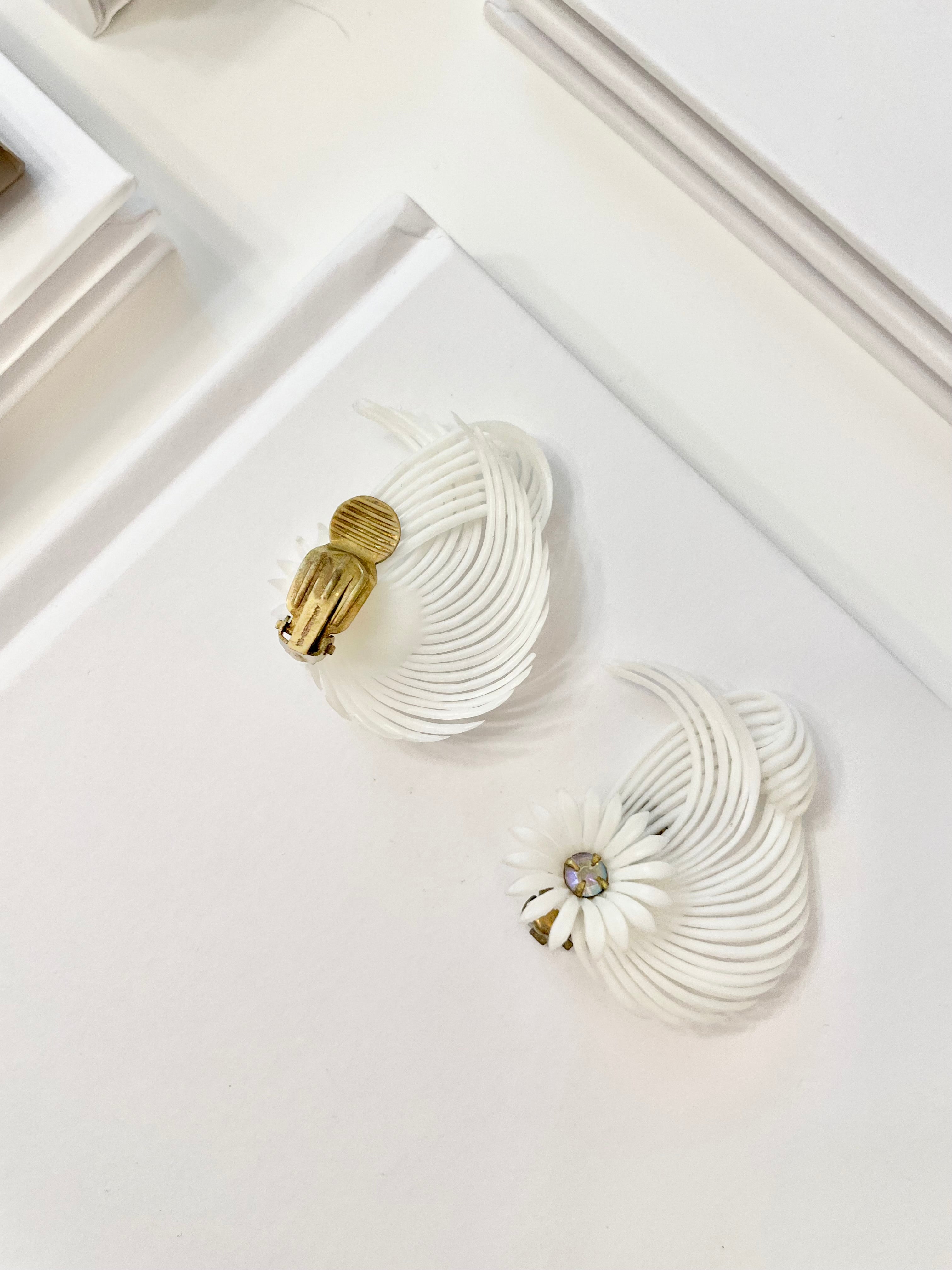 The Cheeky Mistress and her love of the unusual..these 1960's white fan style earrings are so chic!