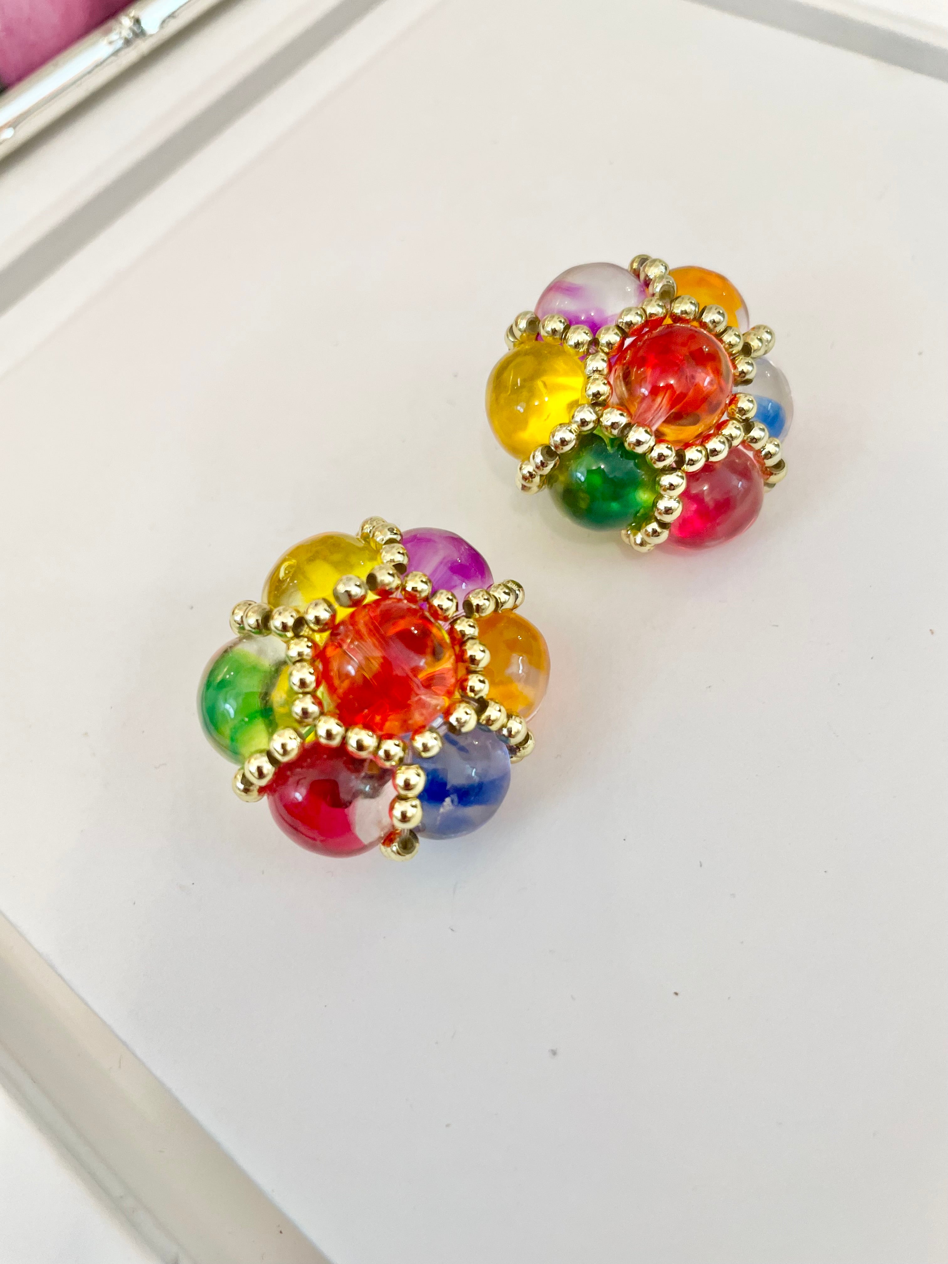 The lady loves nothing more than colorful earrings....so pretty