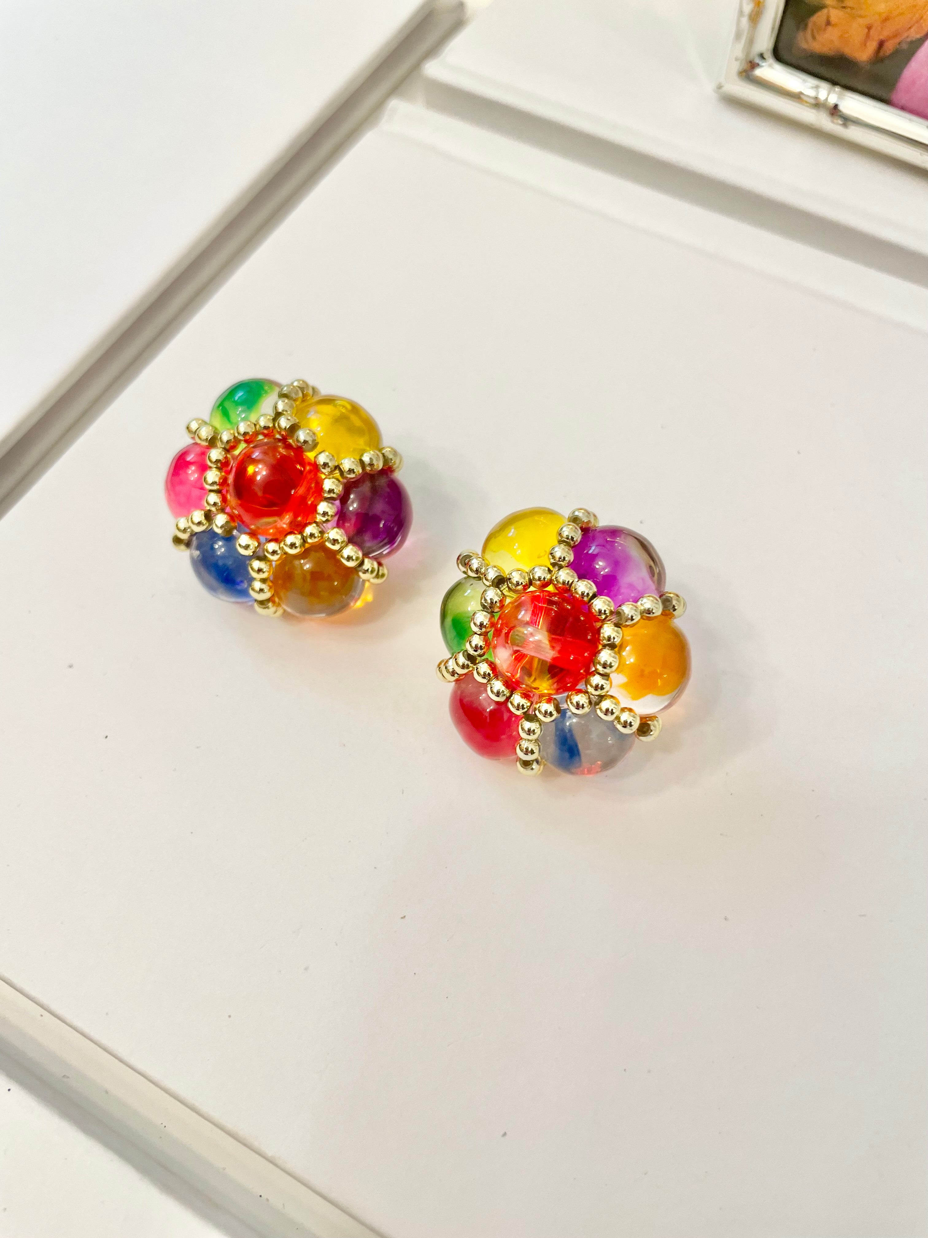 The lady loves nothing more than colorful earrings....so pretty