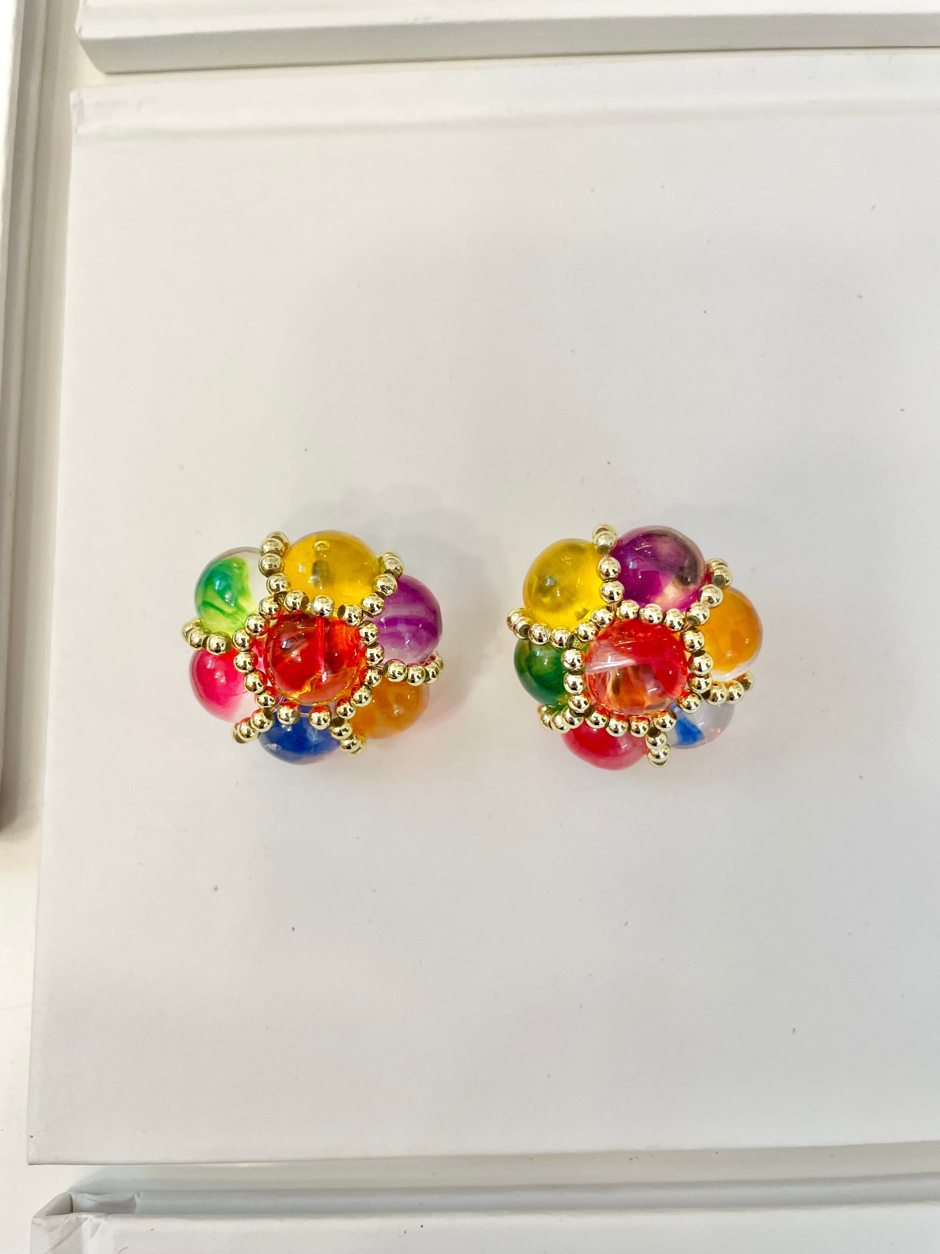 The lady loves nothing more than colorful earrings....so pretty