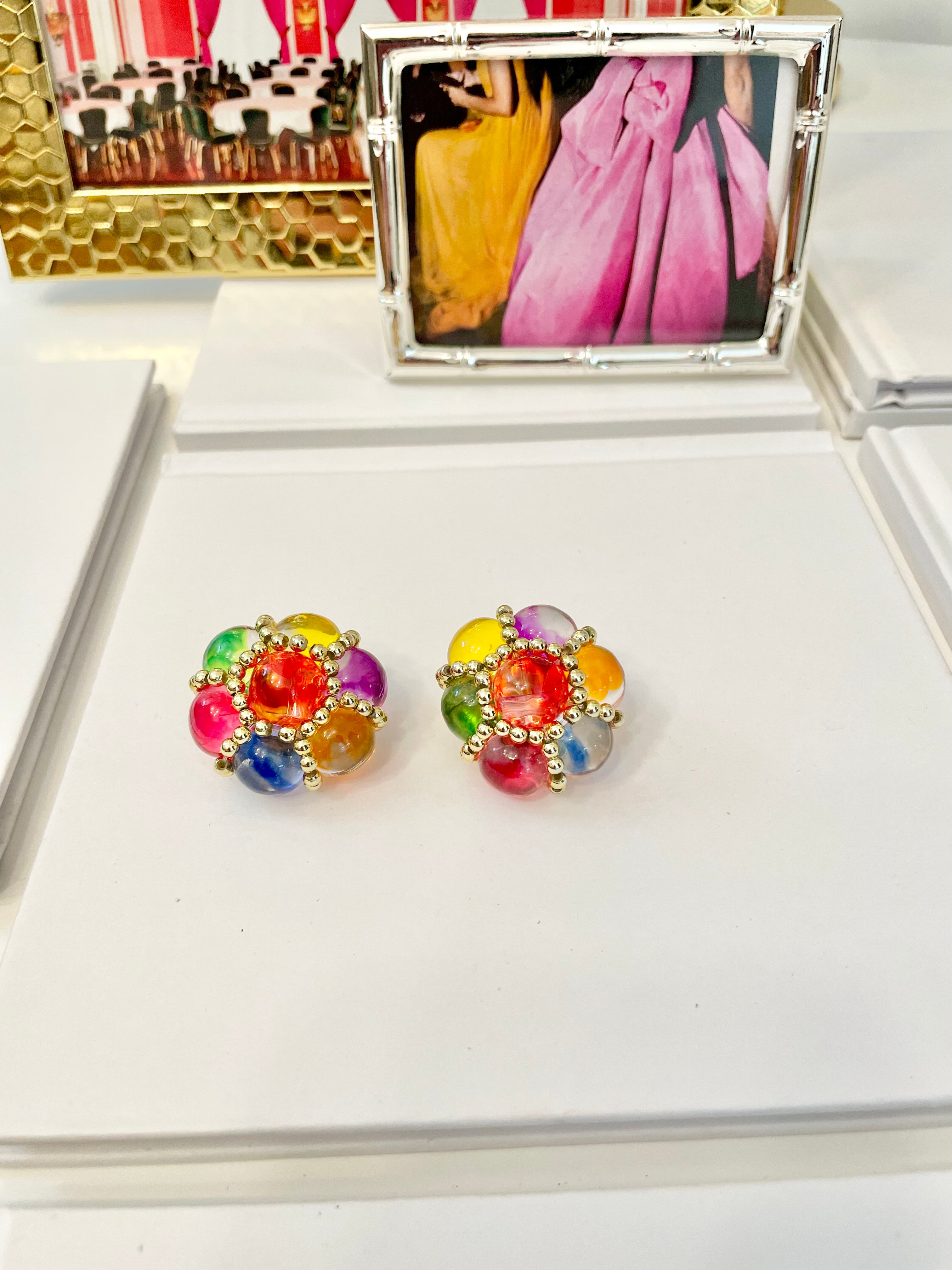 The lady loves nothing more than colorful earrings....so pretty