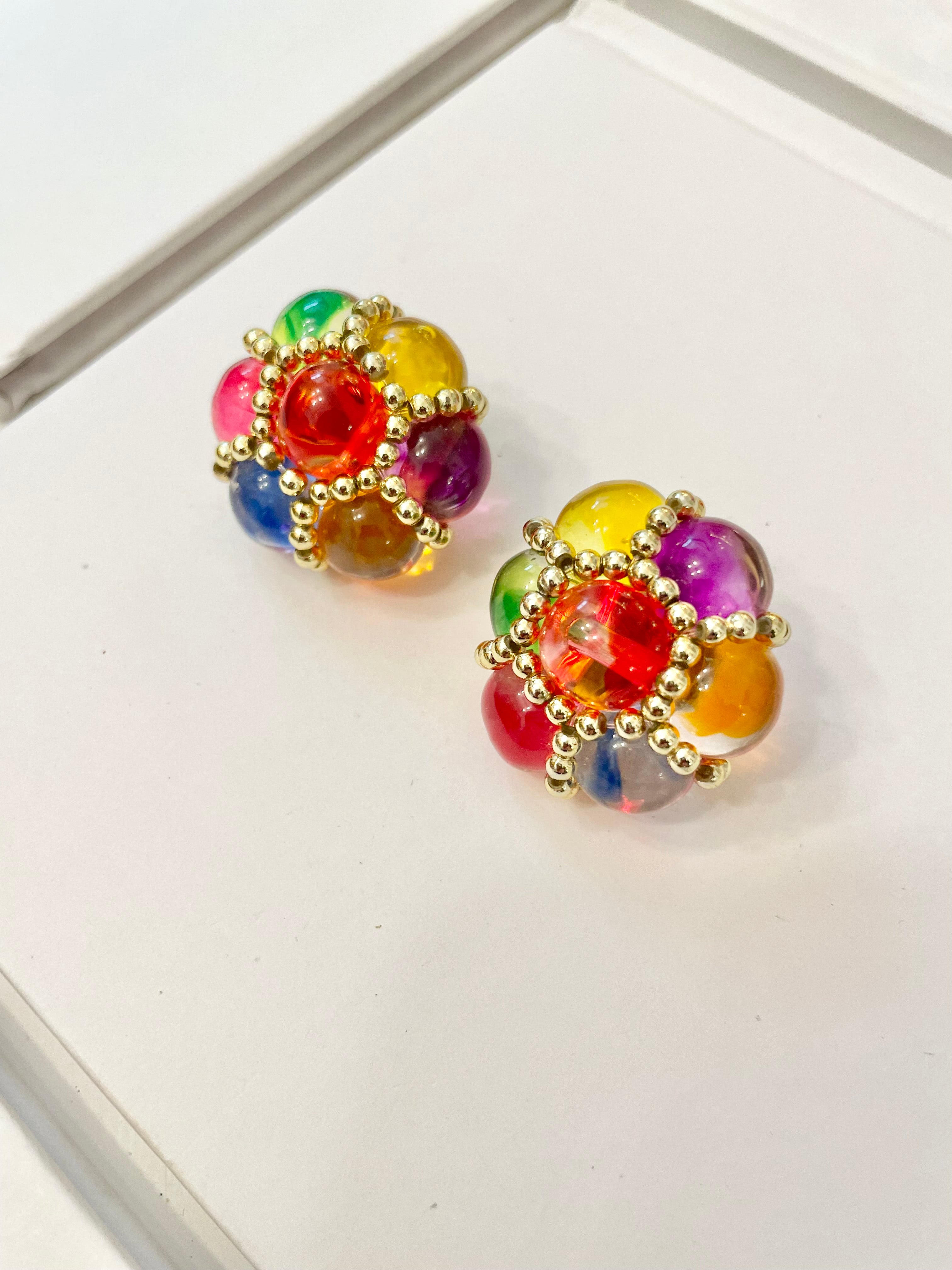 The lady loves nothing more than colorful earrings....so pretty
