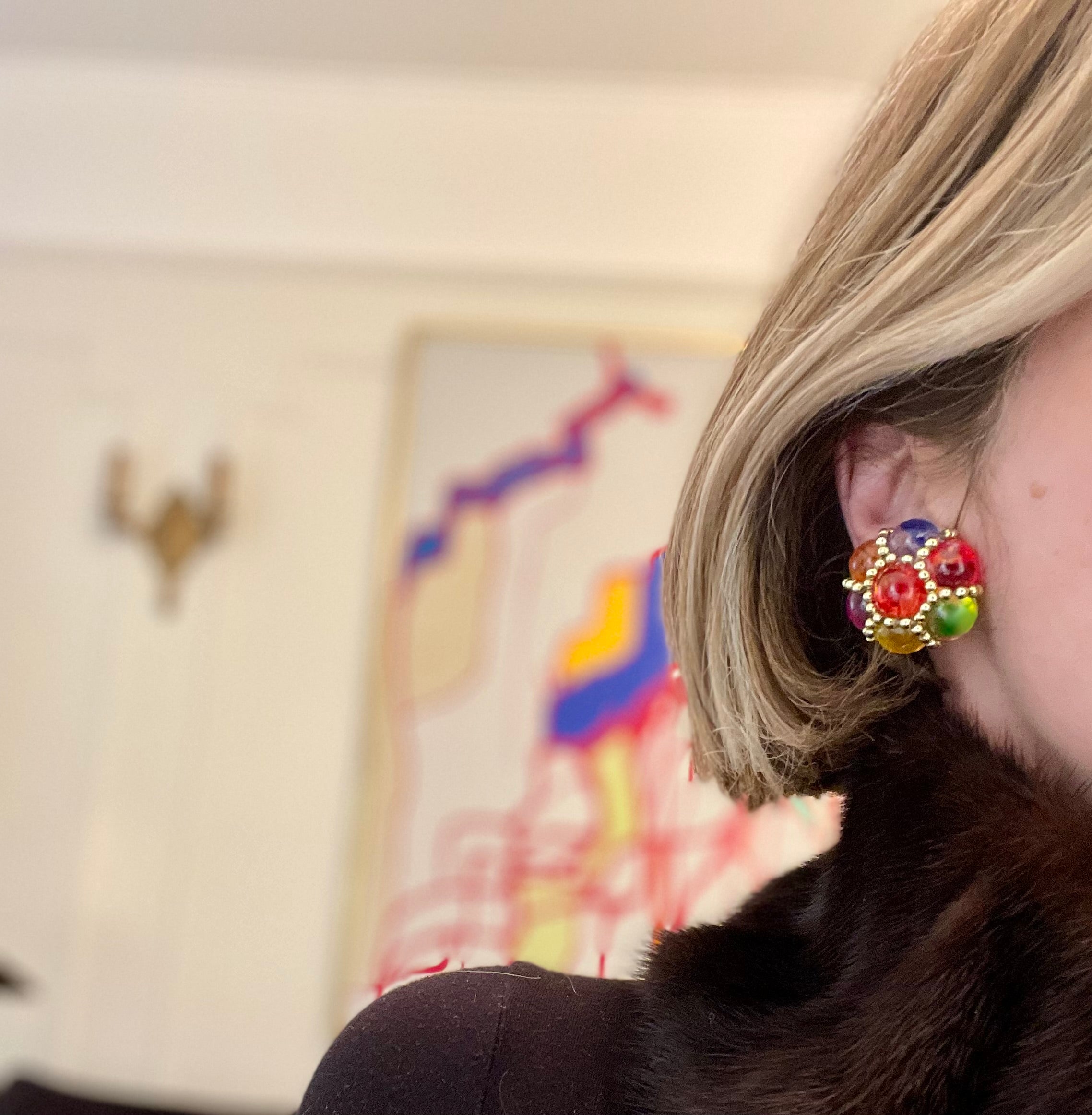 The lady loves nothing more than colorful earrings....so pretty