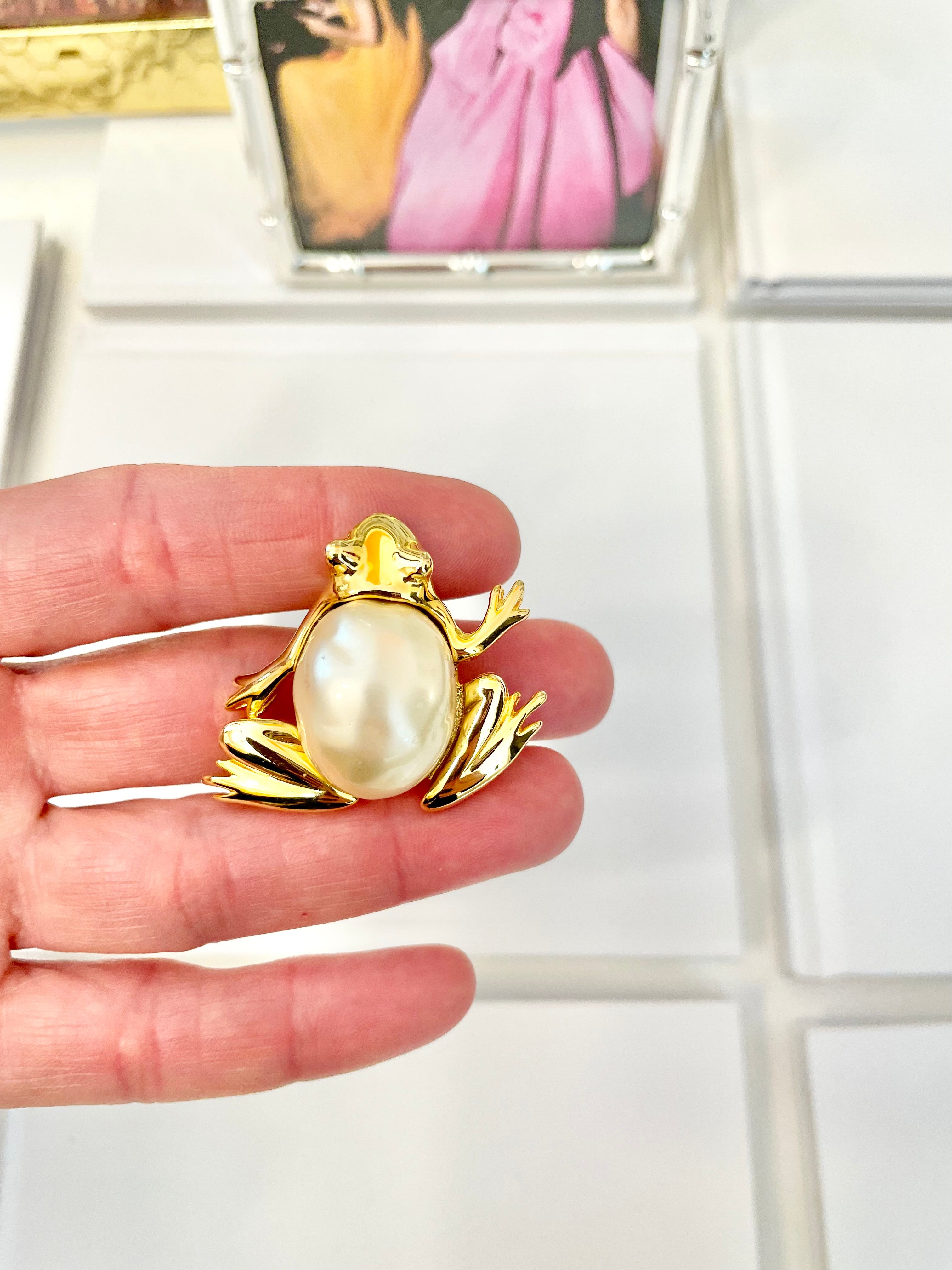 The charming lady loves anything with pearls. This Kenneth Jay lane figural gold brooch is truly divine!