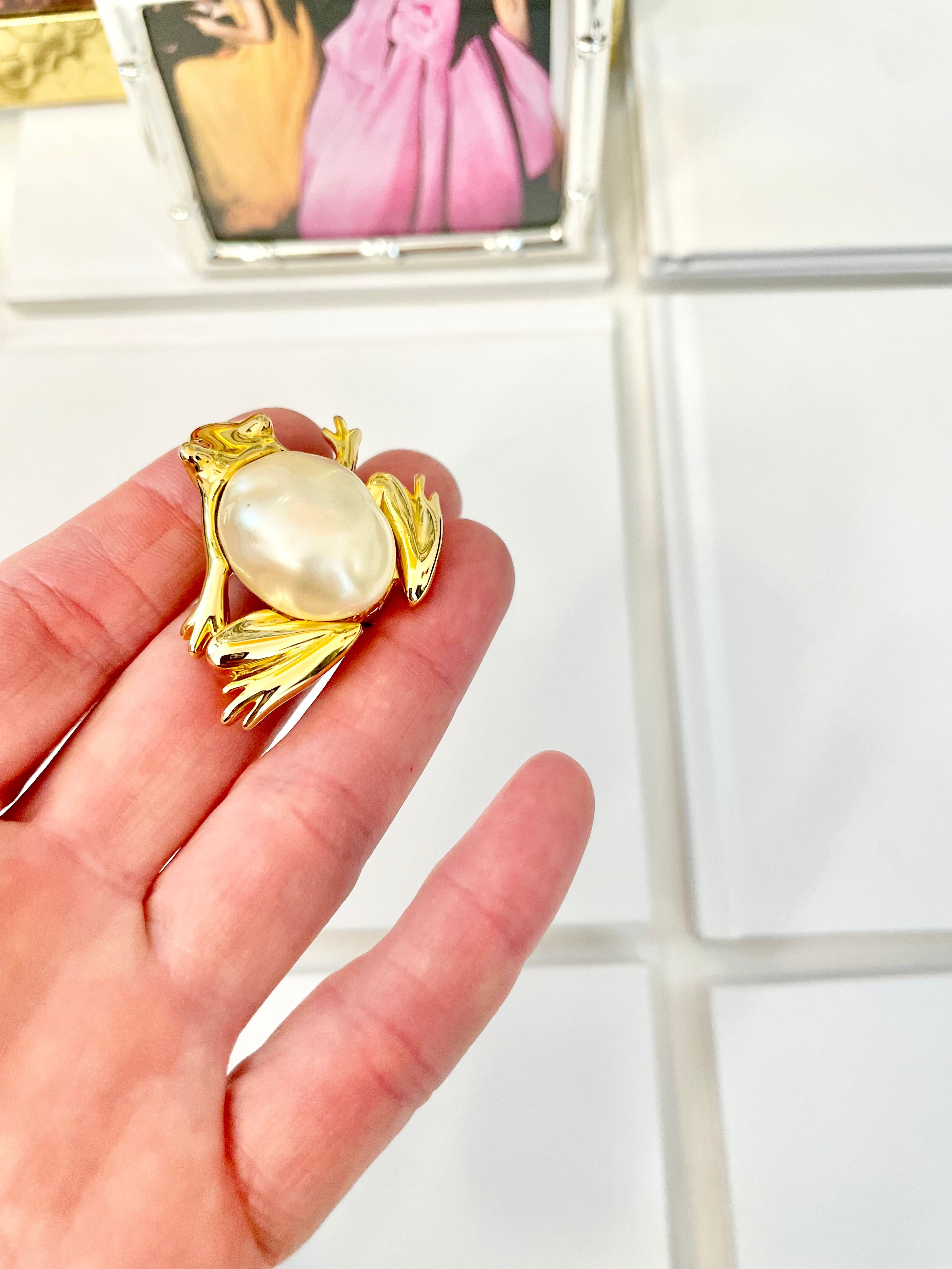 The charming lady loves anything with pearls. This Kenneth Jay lane figural gold brooch is truly divine!