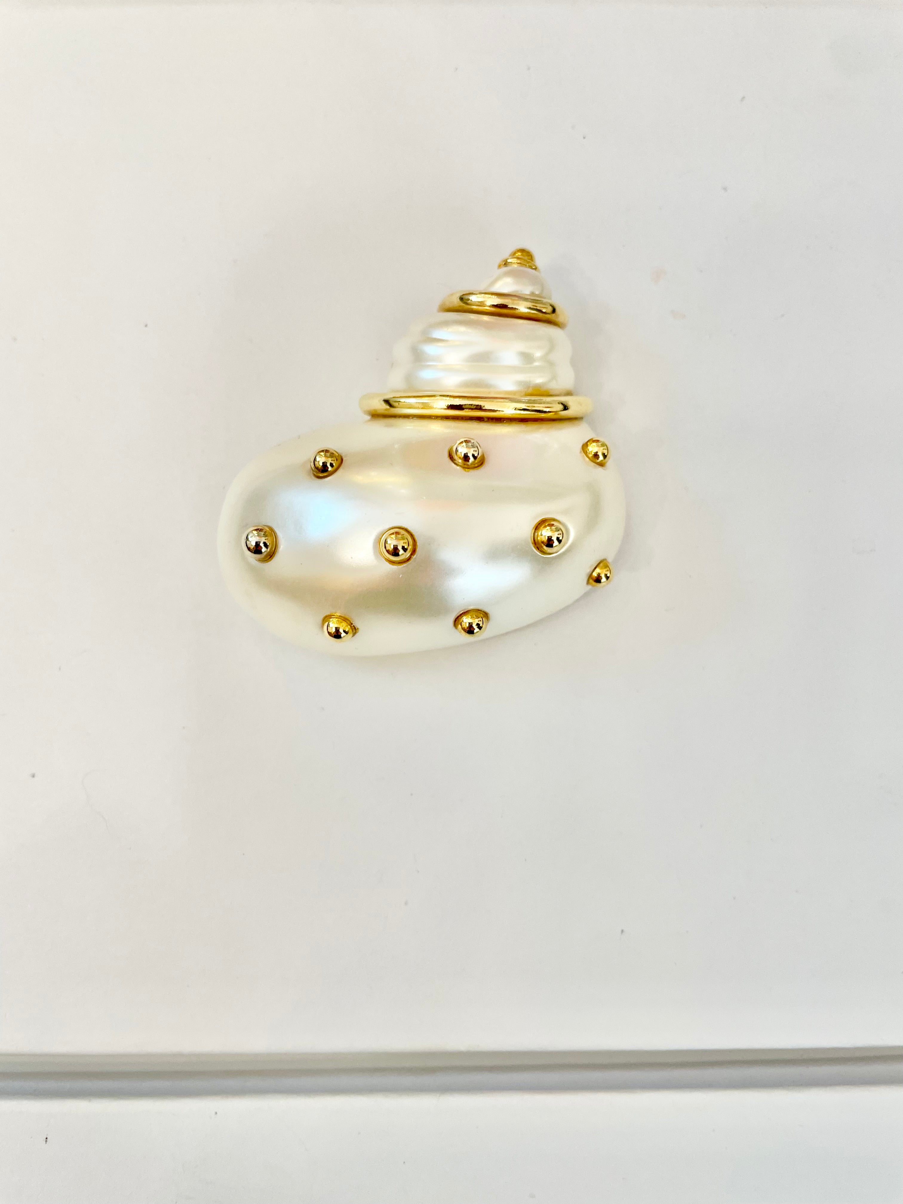 A Kenneth Jay Lane Classic! The classy shell brooch is just divine....