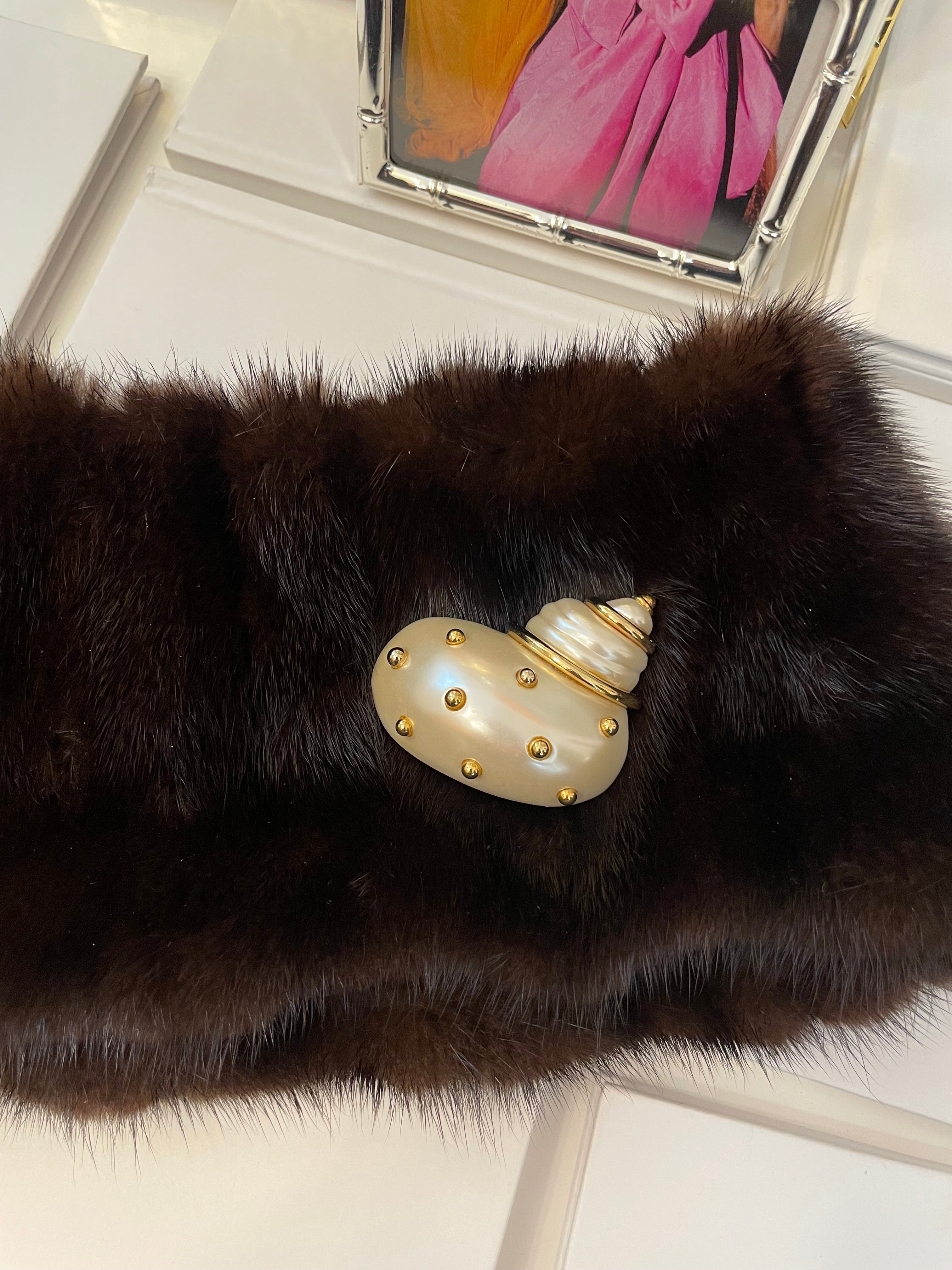 A Kenneth Jay Lane Classic! The classy shell brooch is just divine....