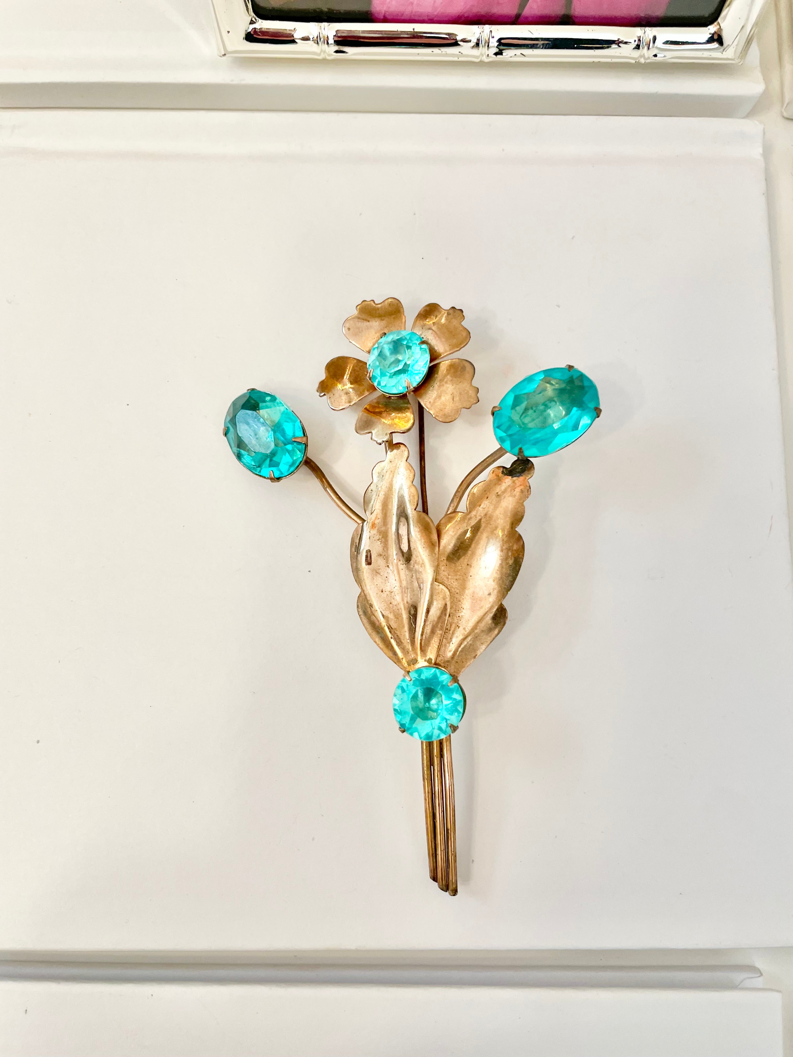 The happiest hostess is a lover of the most colorful jewels... this brooch is divine!
