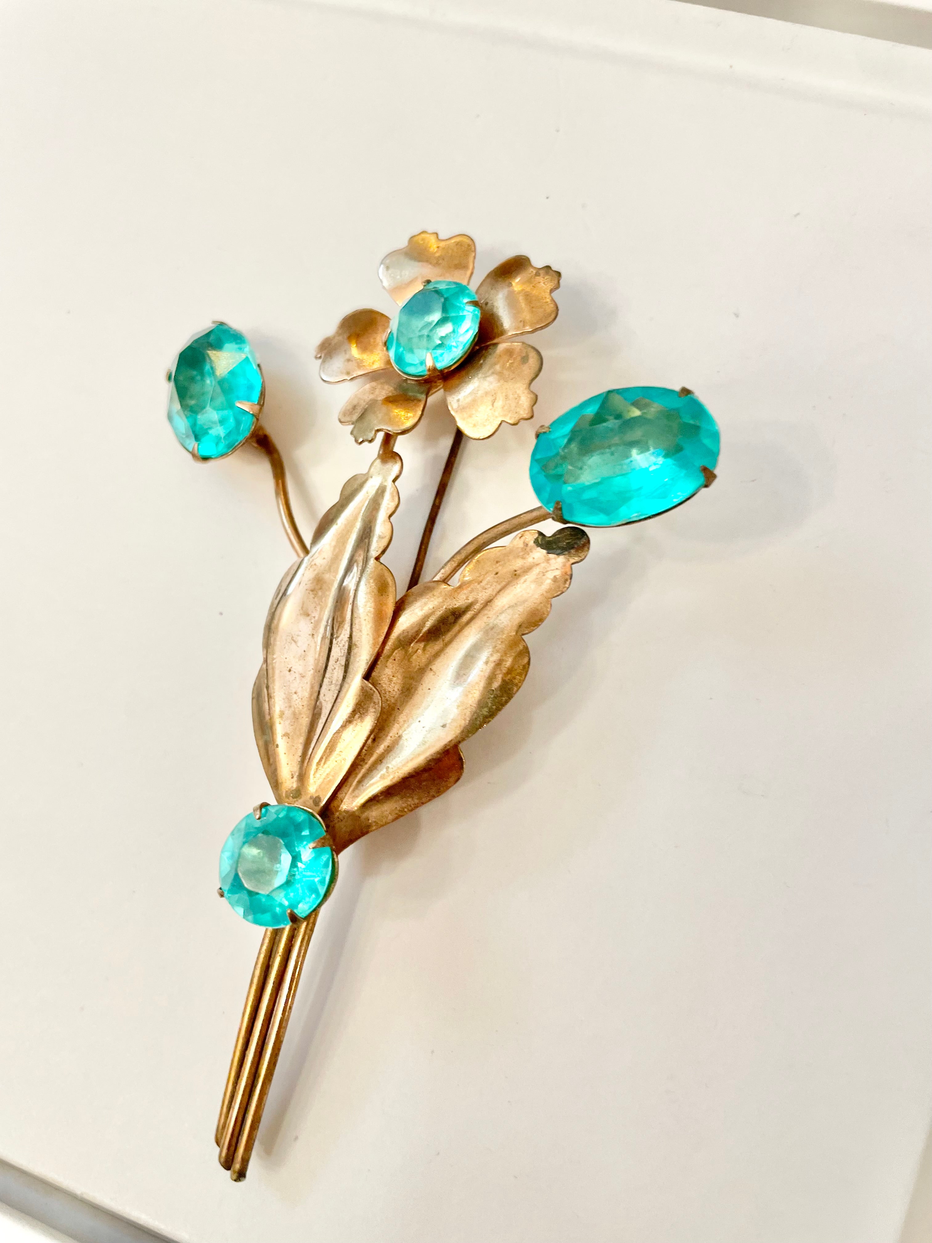 The happiest hostess is a lover of the most colorful jewels... this brooch is divine!