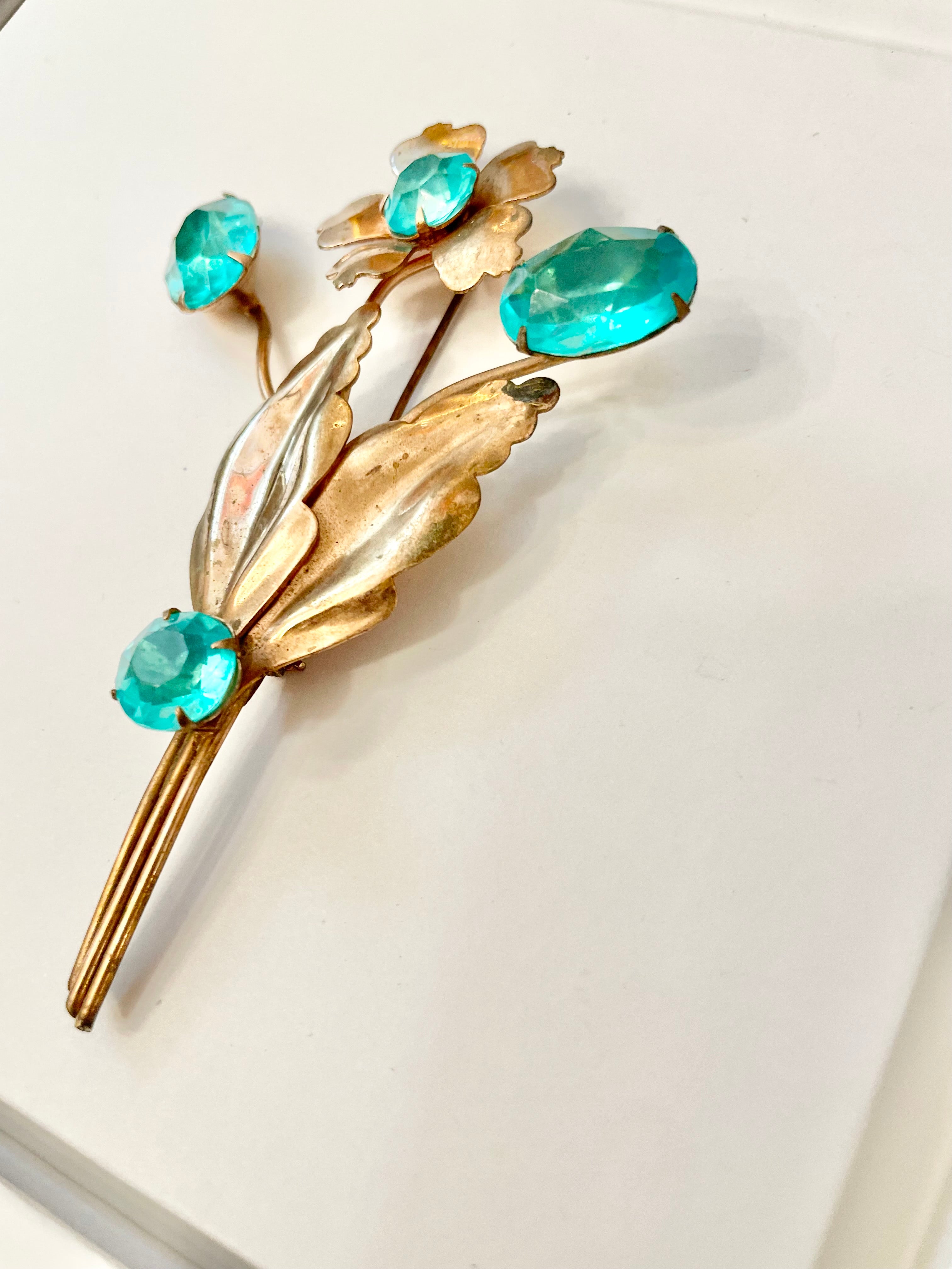 The happiest hostess is a lover of the most colorful jewels... this brooch is divine!