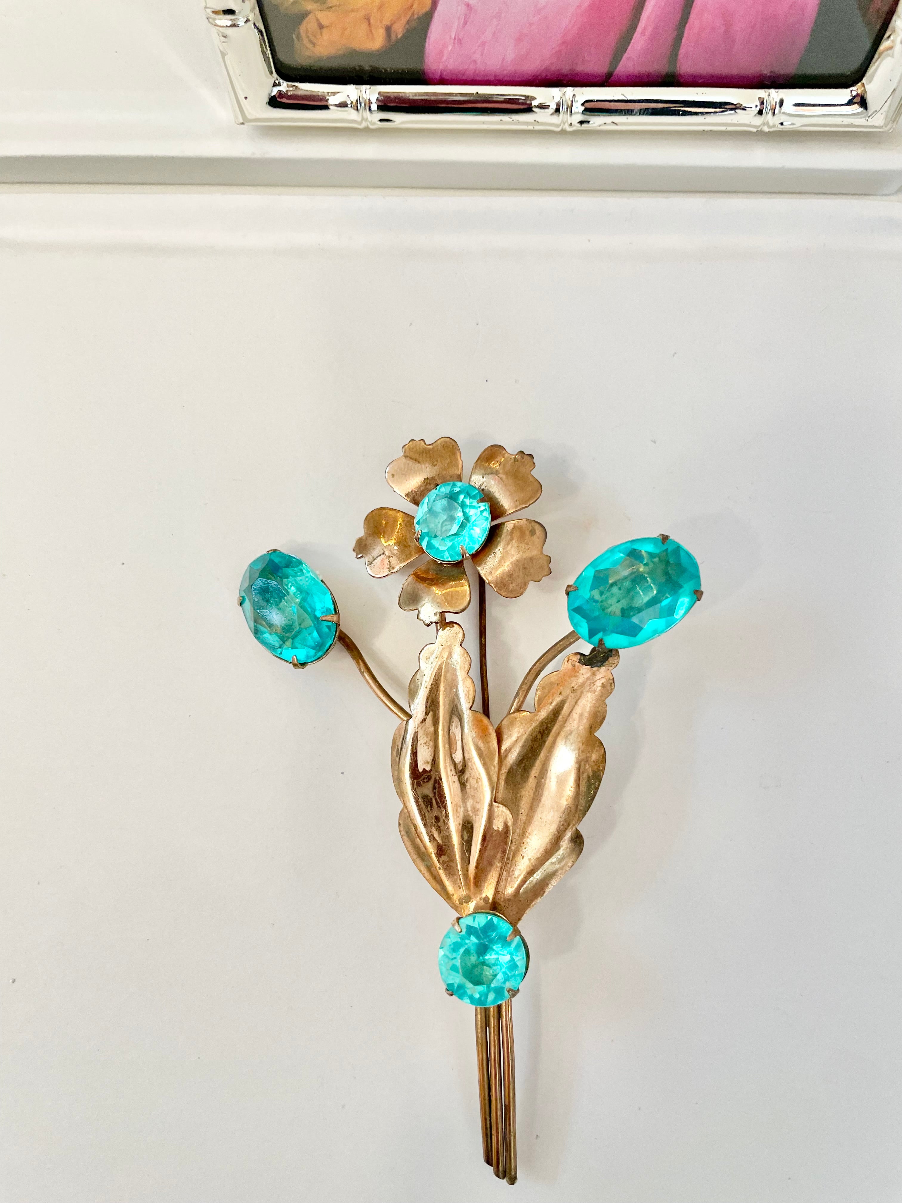 The happiest hostess is a lover of the most colorful jewels... this brooch is divine!